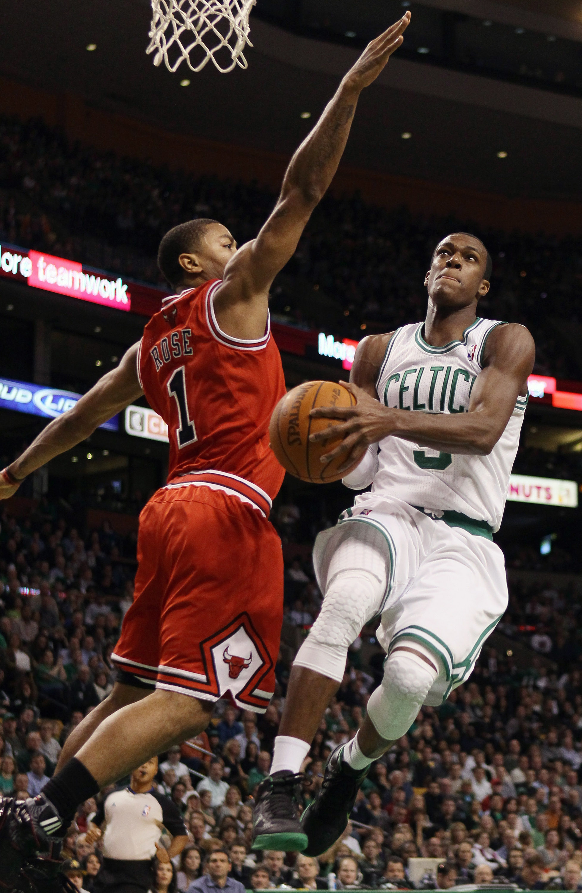 BOSTON, MA - NOVEMBER 05:  Rajon Rondo #9 of the Boston Celtics takes a shot as Derrick Rose #1 of the Chicago Bulls defends on November 5, 2010 at the TD Garden in Boston, Massachusetts.  NOTE TO USER: User expressly acknowledges and agrees that, by down