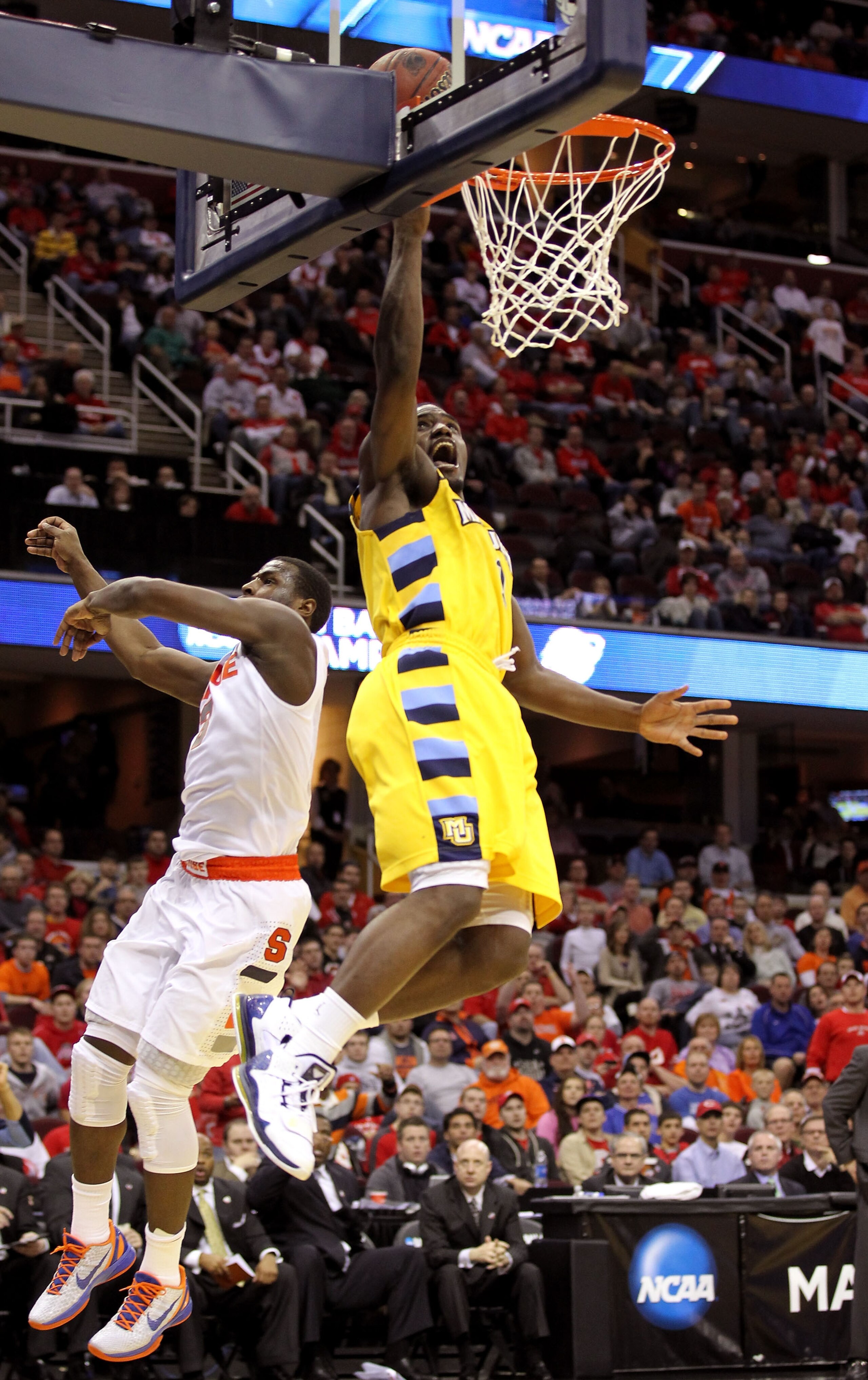 CLEVELAND, OH - MARCH 20: Darius Johnson-Odom #1 of the Marquette Golden Eagles drives to the basket against Dion Waiters #3 of the Syracuse Orange during the third of the 2011 NCAA men's basketball tournament at Quicken Loans Arena on March 20, 2011 in C
