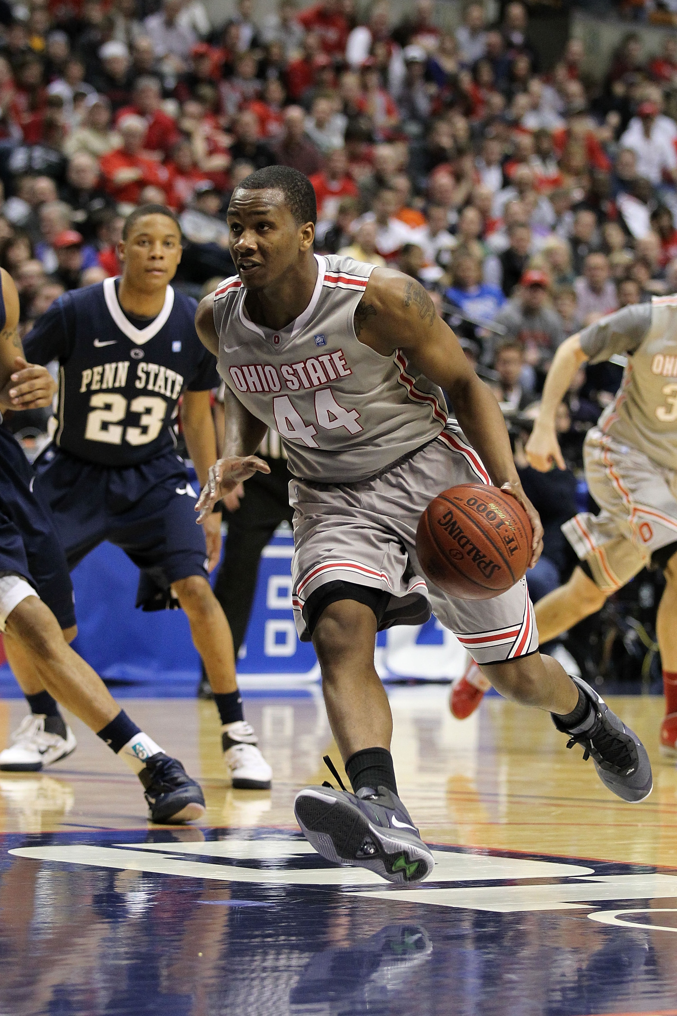 INDIANAPOLIS, IN - MARCH 13:  William Buford #44 of the Ohio State Buckeyes drives against the Penn State Nittany Lions during the championship game of the 2011 Big Ten Men's Basketball Tournament at Conseco Fieldhouse on March 13, 2011 in Indianapolis, I