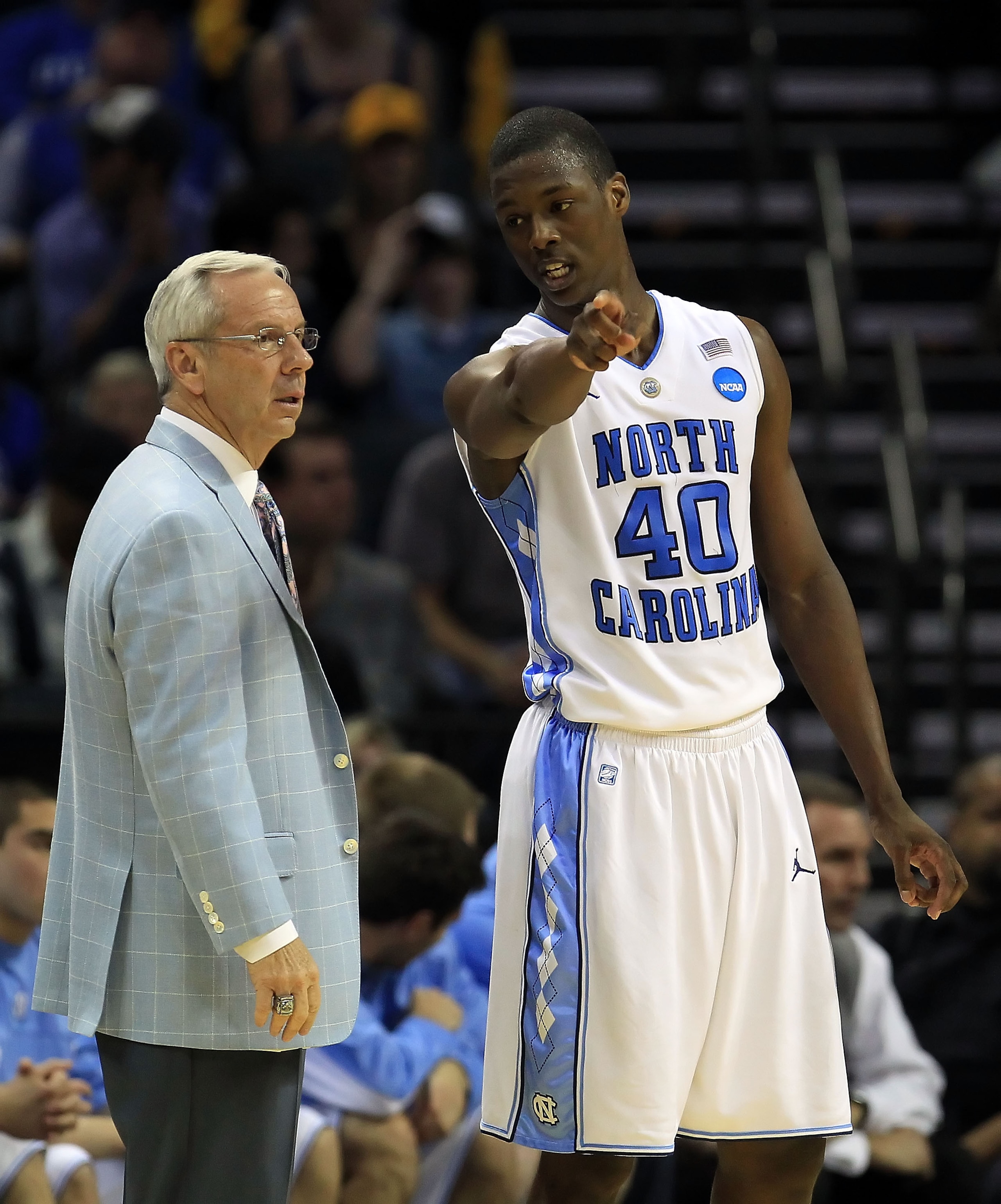 CHARLOTTE, NC - MARCH 20:  Harrison Barnes #40 talks with head coach Roy Williams of the North Carolina Tar Heels while taking on the Washington Huskies during the third round of the 2011 NCAA men's basketball tournament at Time Warner Cable Arena on Marc