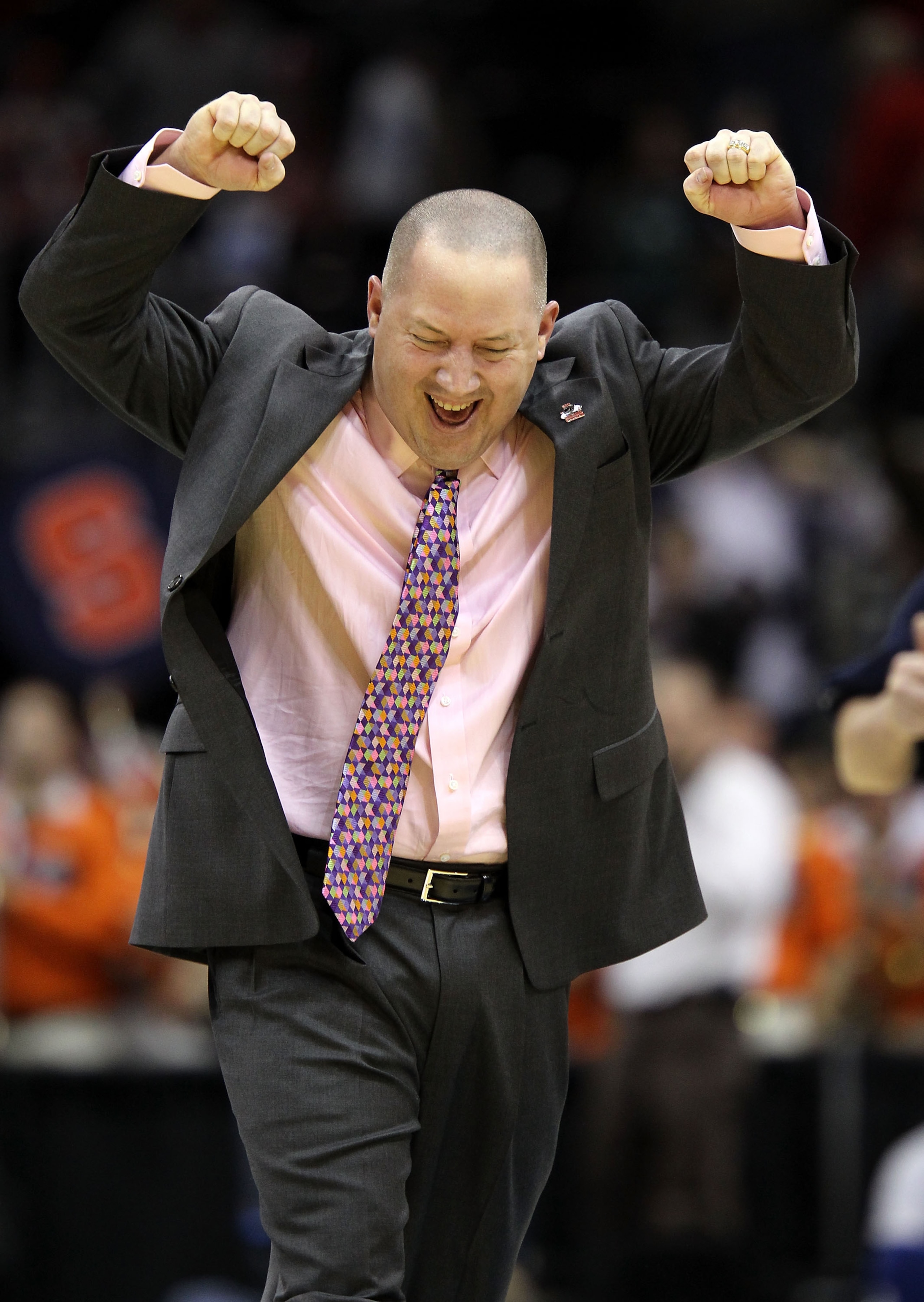 CLEVELAND, OH - MARCH 20:  Head coach Buzz Williams of the Marquette Golden Eagles celebrates on the court after defeating Syracuse Orange during the third of the 2011 NCAA men's basketball tournament at Quicken Loans Arena on March 20, 2011 in Cleveland,