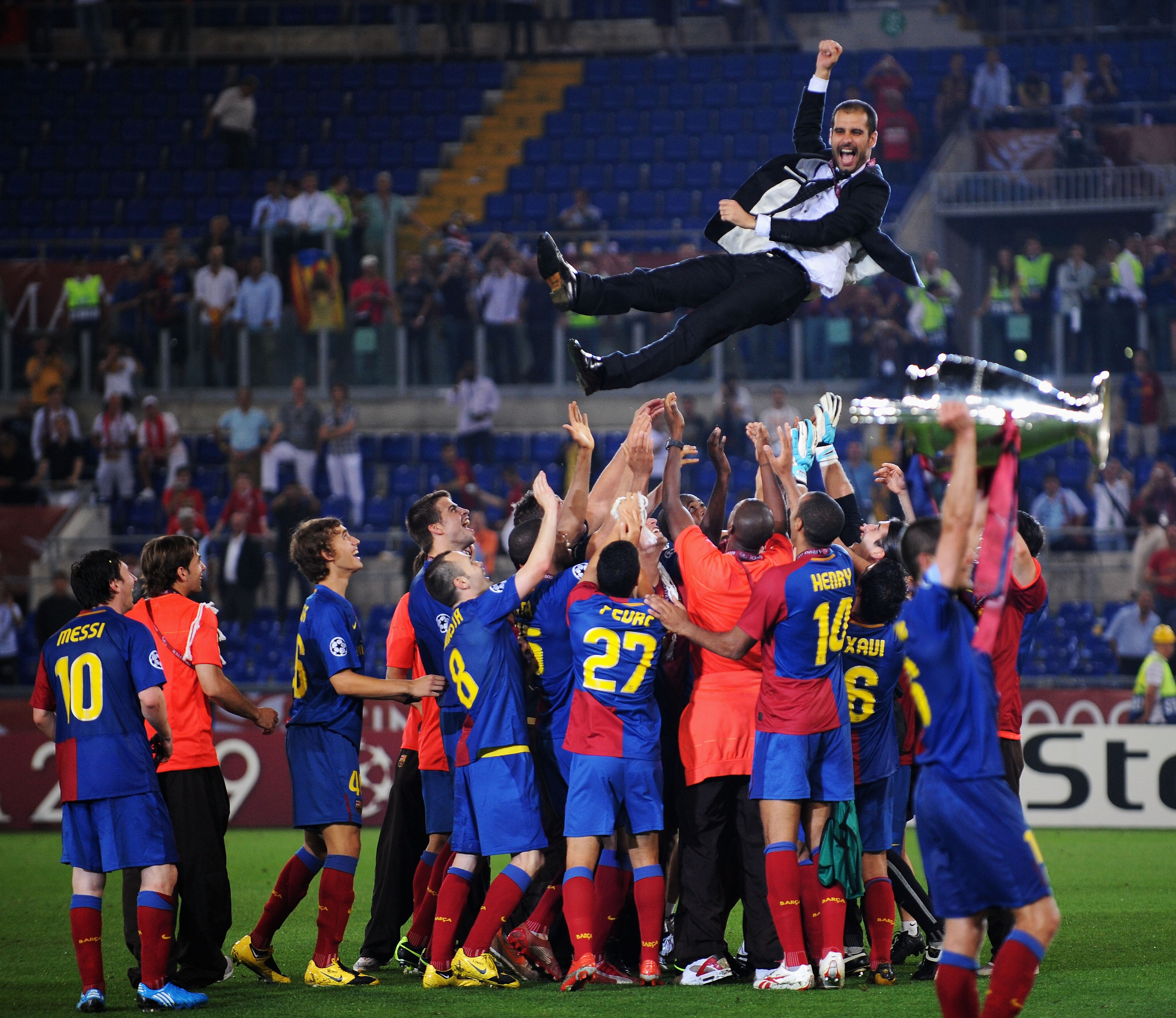ROME - MAY 27:  Josep Guardiola coach of Barcelona is  thrown into the air by his players as they celebrate winning the UEFA Champions League Final match between Manchester United and Barcelona at the Stadio Olimpico on May 27, 2009 in Rome, Italy.  (Phot