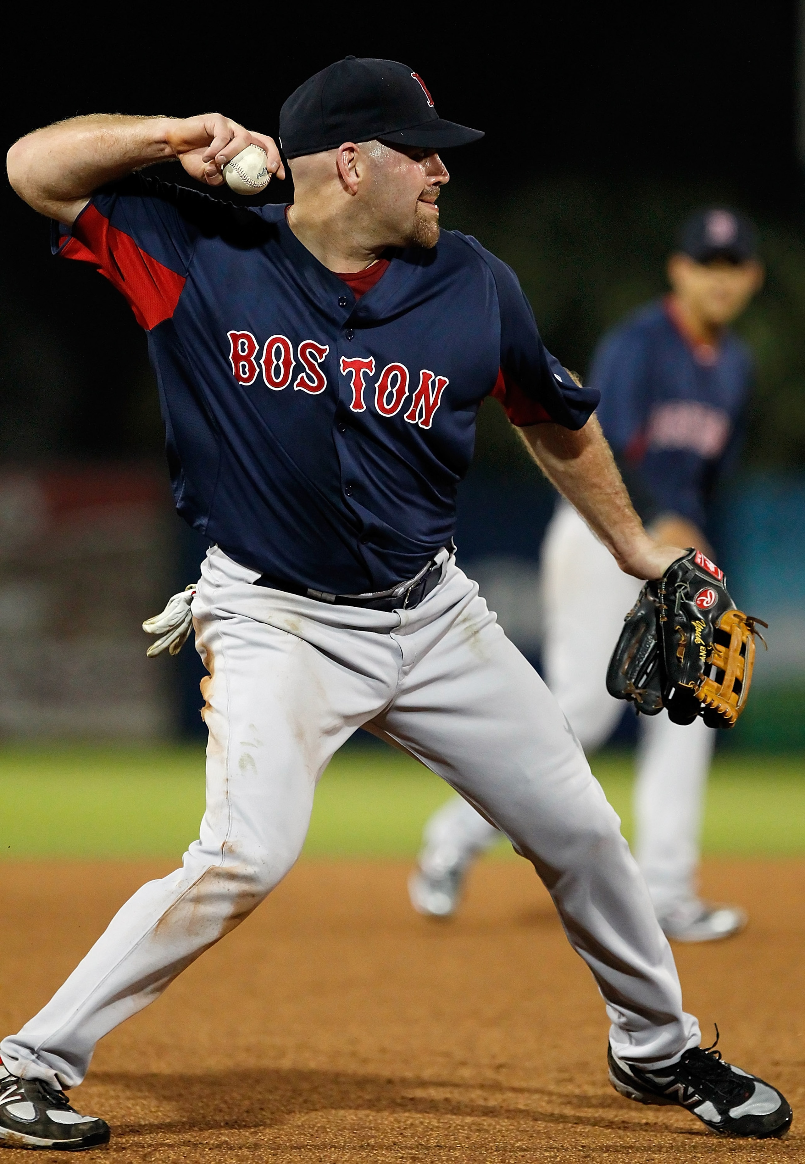 FORT MYERS, FL - FEBRUARY 27:  Infielder Kevin Youkilis #20 of the Boston Red Sox throws over to first for an out against the Minnesota Twins during a Grapefruit League Spring Training Game at Hammond Stadium on February 27, 2011 in Fort Myers, Florida.