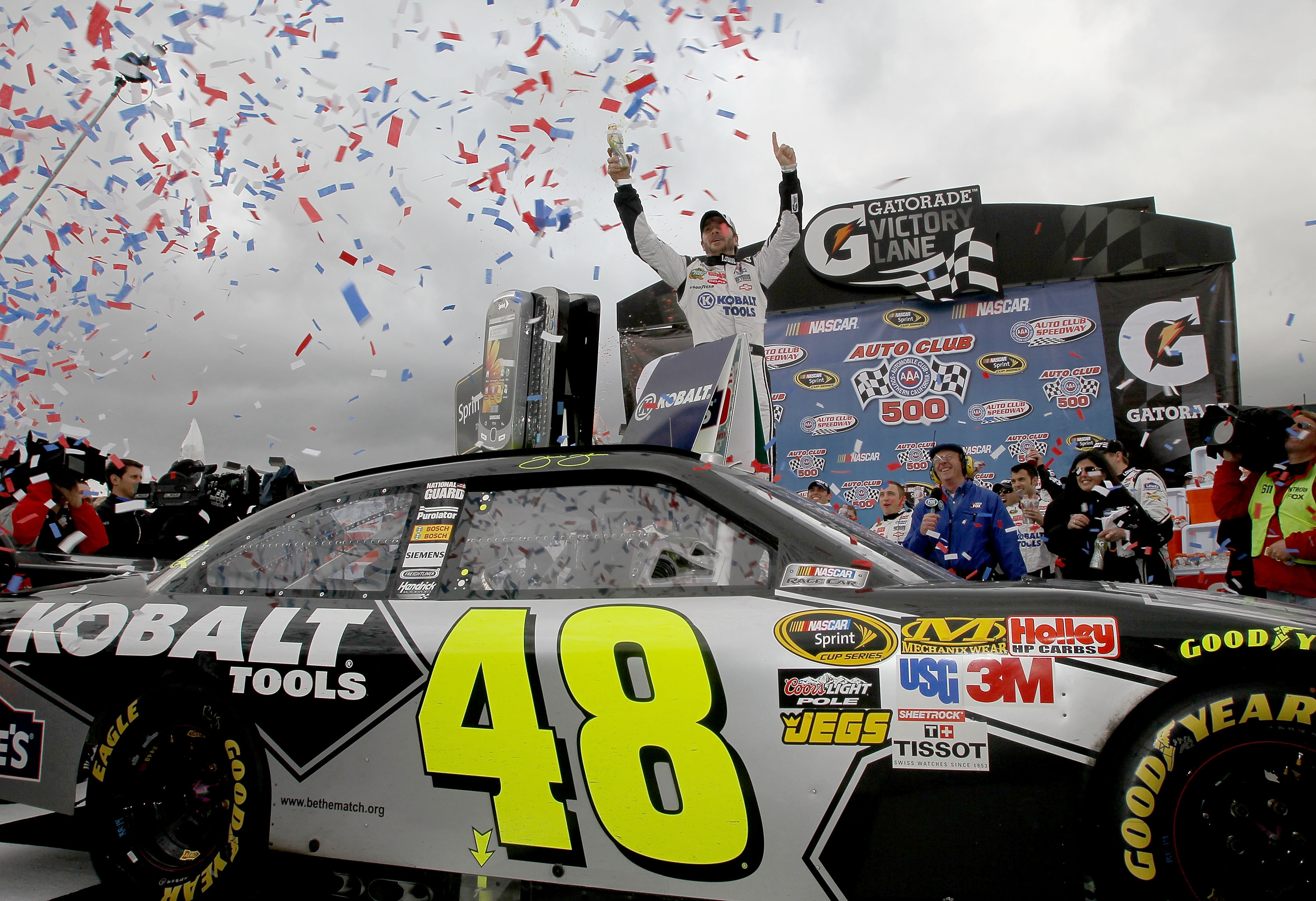 FONTANA, CA - FEBRUARY 21:  Jimmie Johnson, driver of the #48 Lowe's/Kobalt Tools Chevrolet, celebrates in victory lane after winning the NASCAR Sprint Cup Series Auto Club 500 at Auto Club Speedway on February 21, 2010 in Fontana, California.  (Photo by