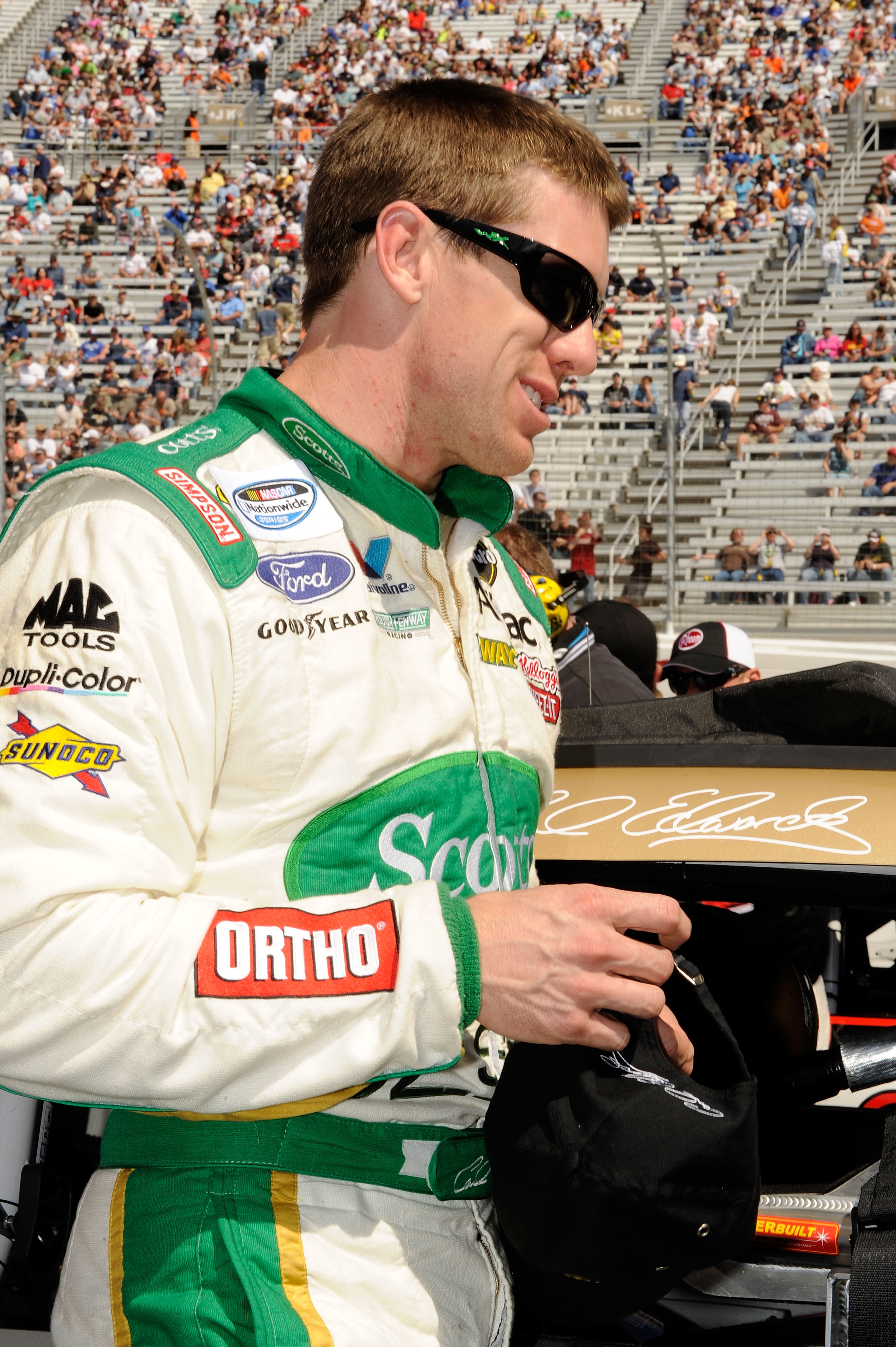 BRISTOL, TN - MARCH 19:  Carl Edwards, driver of the #60 Scotts EZ Seed Ford, stands next to his car on the grid prior to the start of the NASCAR Nationwide Series Scotts EZ Seed 300 at Bristol Motor Speedway on March 19, 2011 in Bristol, Tennessee.  (Pho