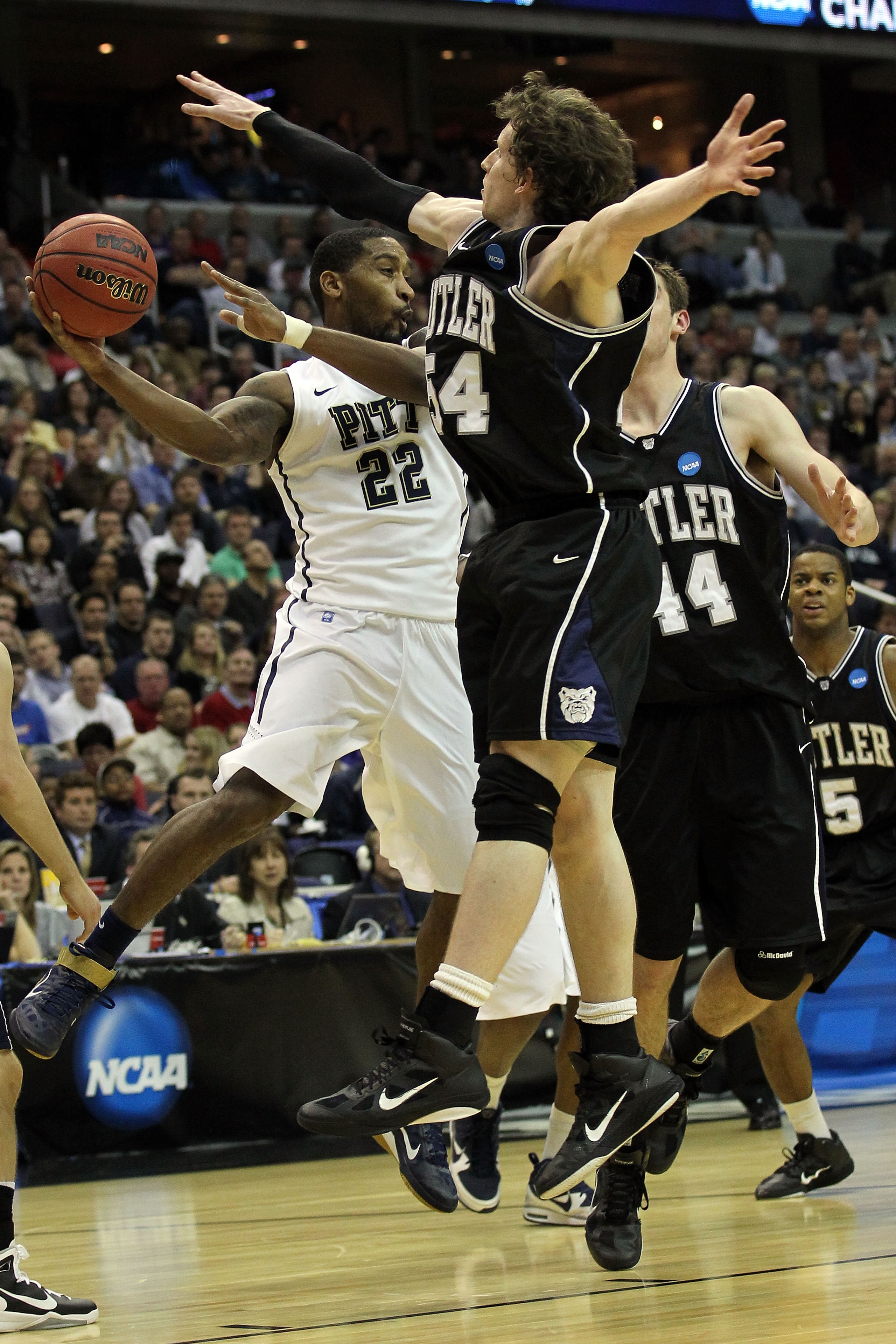 WASHINGTON - MARCH 19:  Brad Wanamaker #22 of the Pittsburgh Panthers tries to pass past Matt Howard #54 and Andrew Smith #44 of the Butler Bulldogs during the third round of the 2011 NCAA men's basketball tournament at Verizon Center on March 19, 2011 in