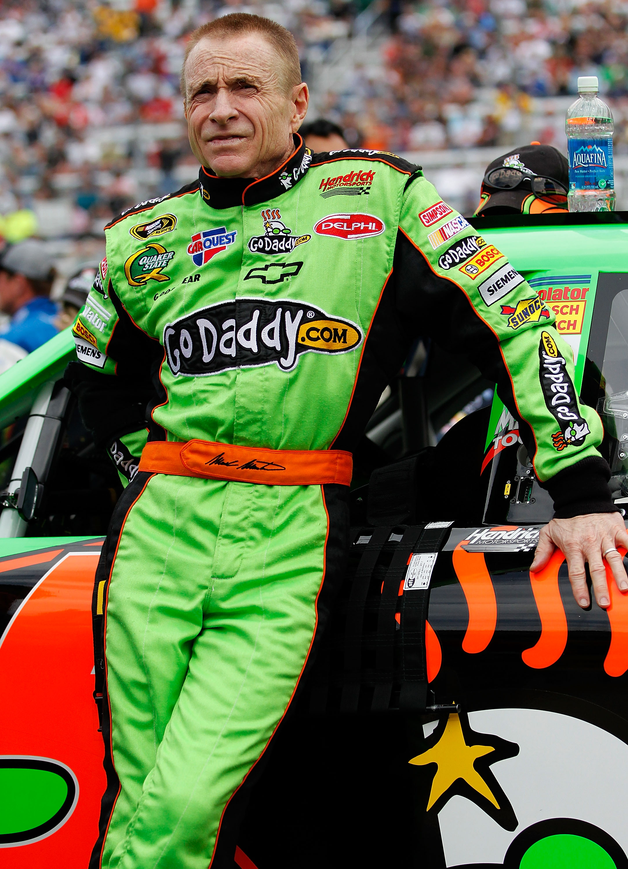 BRISTOL, TN - MARCH 20: Mark Martin, driver of the #5 GoDaddy.com Chevrolet, stands on the grid prior to the start of the NASCAR Sprint Cup Series Jeff Byrd 500 Presented By Food City at Bristol Motor Speedway on March 20, 2011 in Bristol, Tennessee.  (Ph
