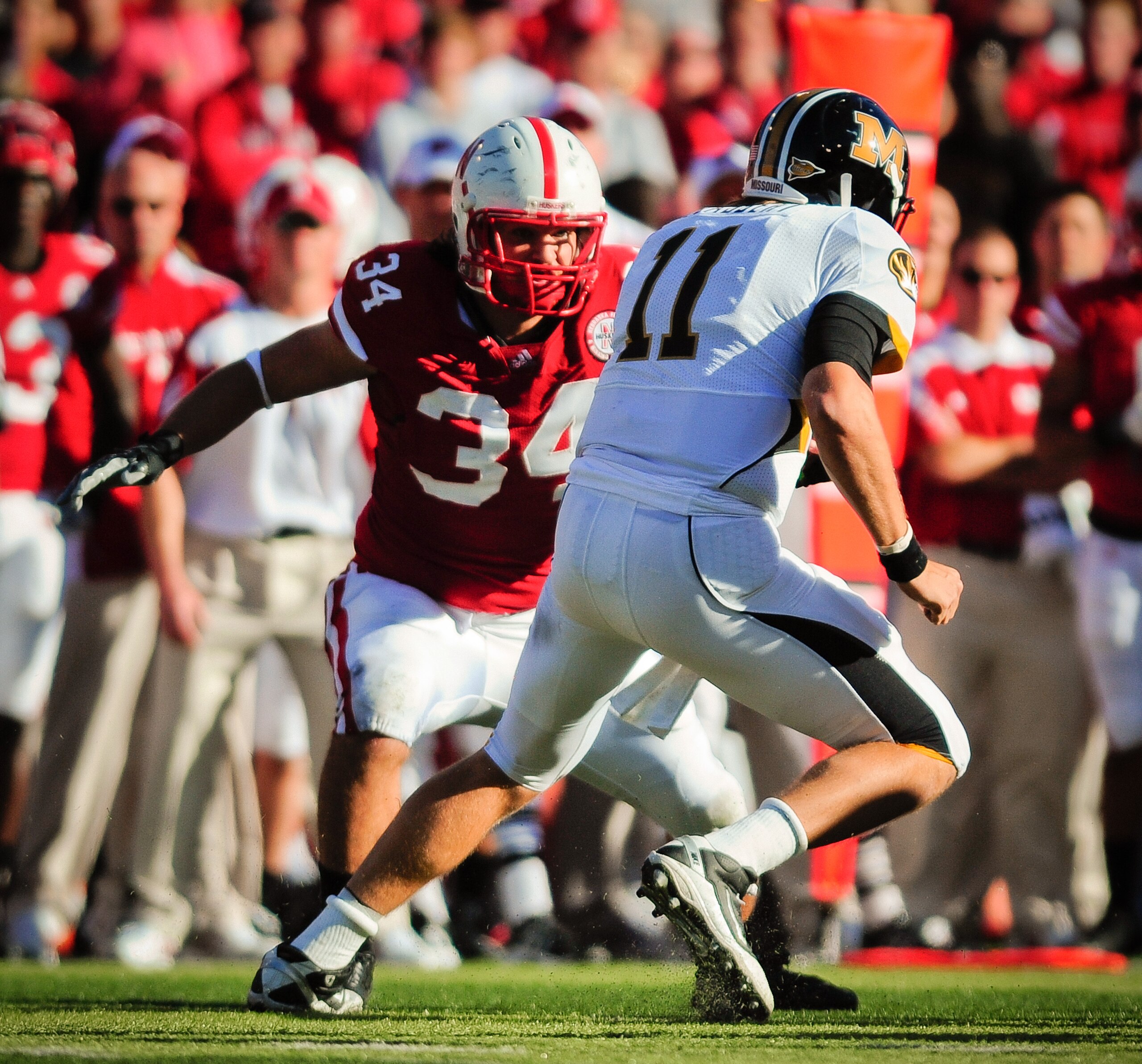 LINCOLN, NE - OCTOBER 30: Defensive end Cameron Meredith #34 of the Nebraska Cornhuskers closes in on  quarterback Blaine Gabbert #11of the Missouri Tigers during first half action of their game at Memorial Stadium on October 30, 2010 in Lincoln, Nebraska