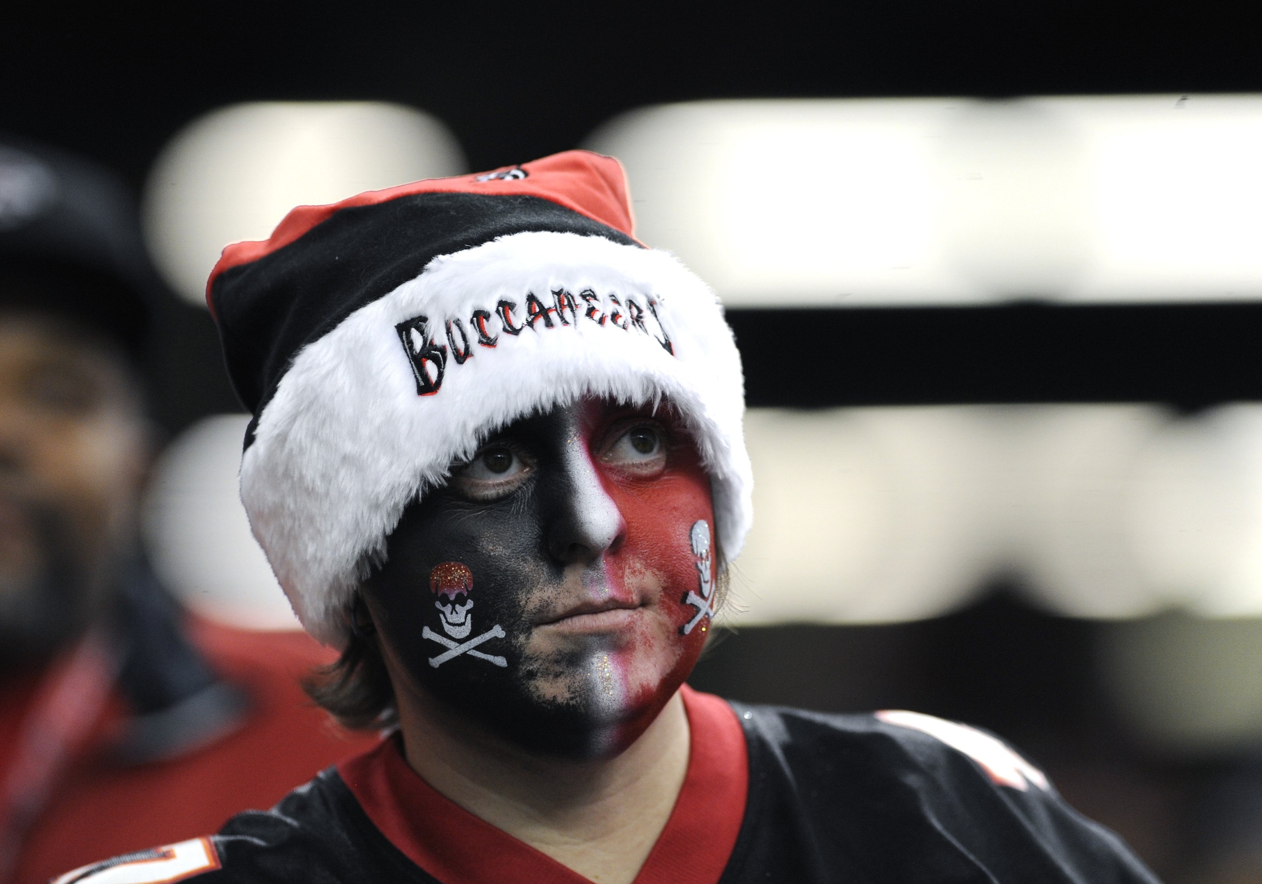 ATLANTA - DECEMBER 14: A fan of the Atlanta Falcons watches play  against the Tampa Bay Buccaneers  at the Georgia Dome on December 14, 2008 in Atlanta, Georgia.  (Photo by Al Messerschmidt/Getty Images)