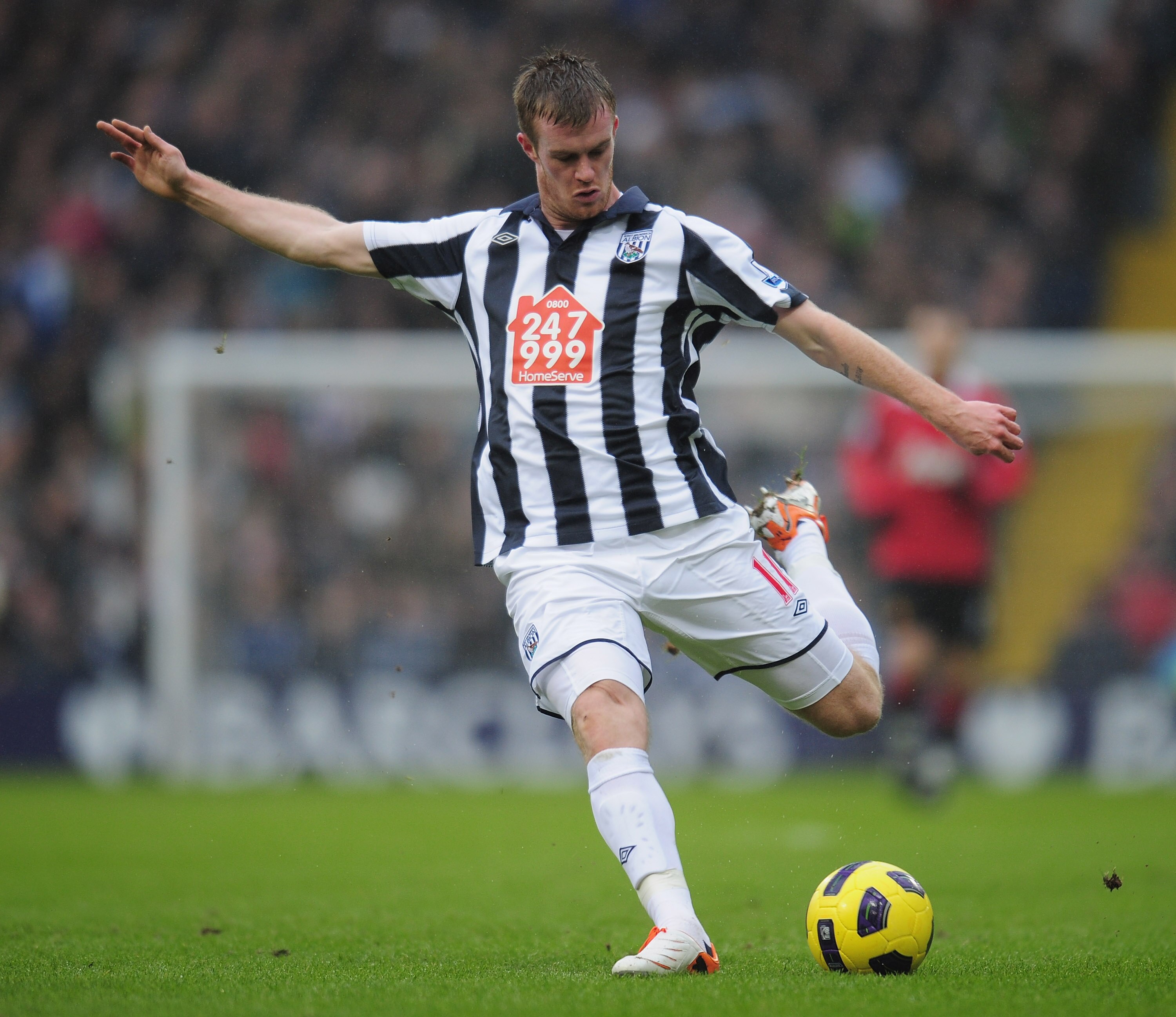 WEST BROMWICH, ENGLAND - JANUARY 01:  Chris Brunt of West Bromich Albion fires in a shot during the Barclays Premier League match between West Bromich Albion and Manchester United at The Hawthorns on January 1, 2011 in West Bromwich, England.  (Photo by S
