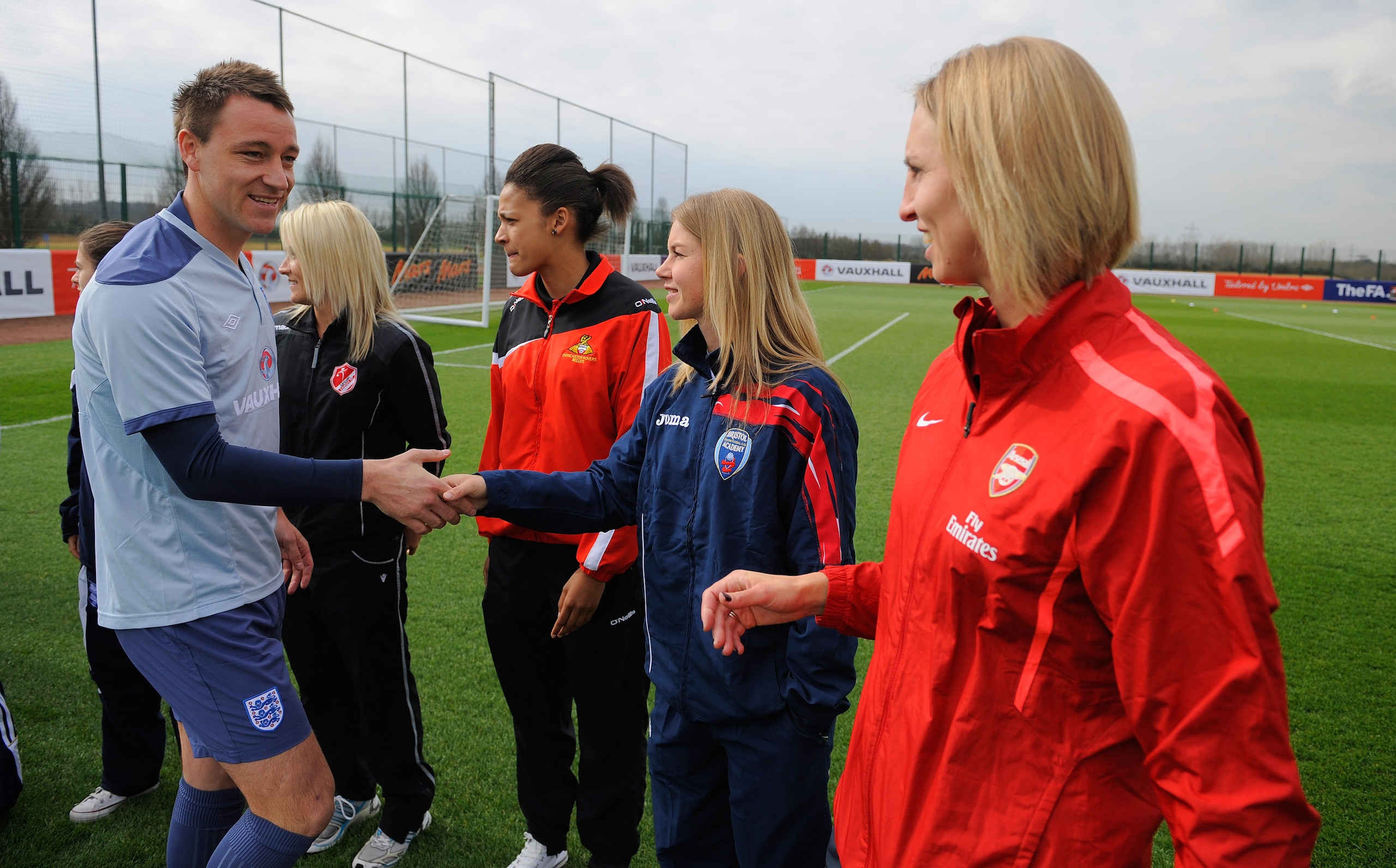 ST ALBANS, ENGLAND - MARCH 22: John Terry meets players from the Women's Super League during the England training session ahead of their UEFA EURO 2012 qualifier against Wales, at London Colney on March 22, 2011 in St Albans, England.  (Photo by Michael R