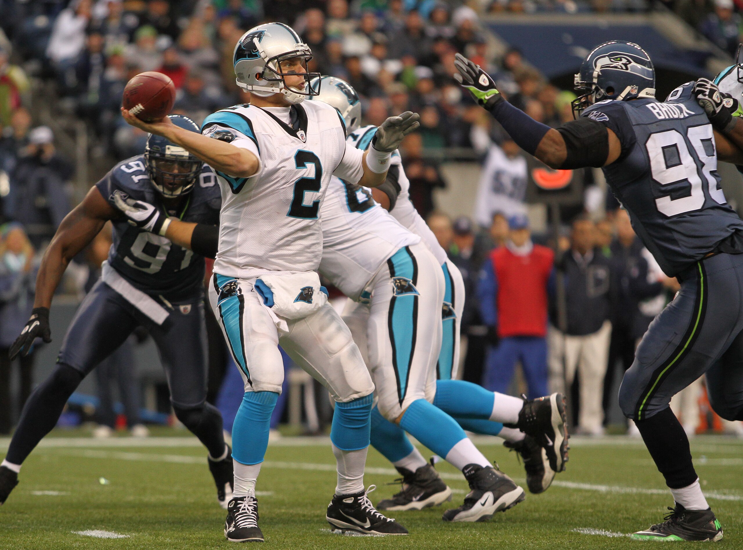 SEATTLE - DECEMBER 05: Quarterback Jimmy Clausen #2 of the Carolina Panthers passes against Raheem Brock #98 of the Seattle Seahawks at Qwest Field on December 5, 2010 in Seattle, Washington. The Seahawks won, 31-14. (Photo by Otto Greule Jr/Getty Images SEATTLE - DECEMBER 05: Quarterback Jimmy Clausen #2 of the Carolina Panthers passes against Raheem Brock #98 of the Seattle Seahawks at Qwest Field on December 5, 2010 in Seattle, Washington. The Seahawks won, 31-14. (Photo by Otto Greule Jr/Getty Images