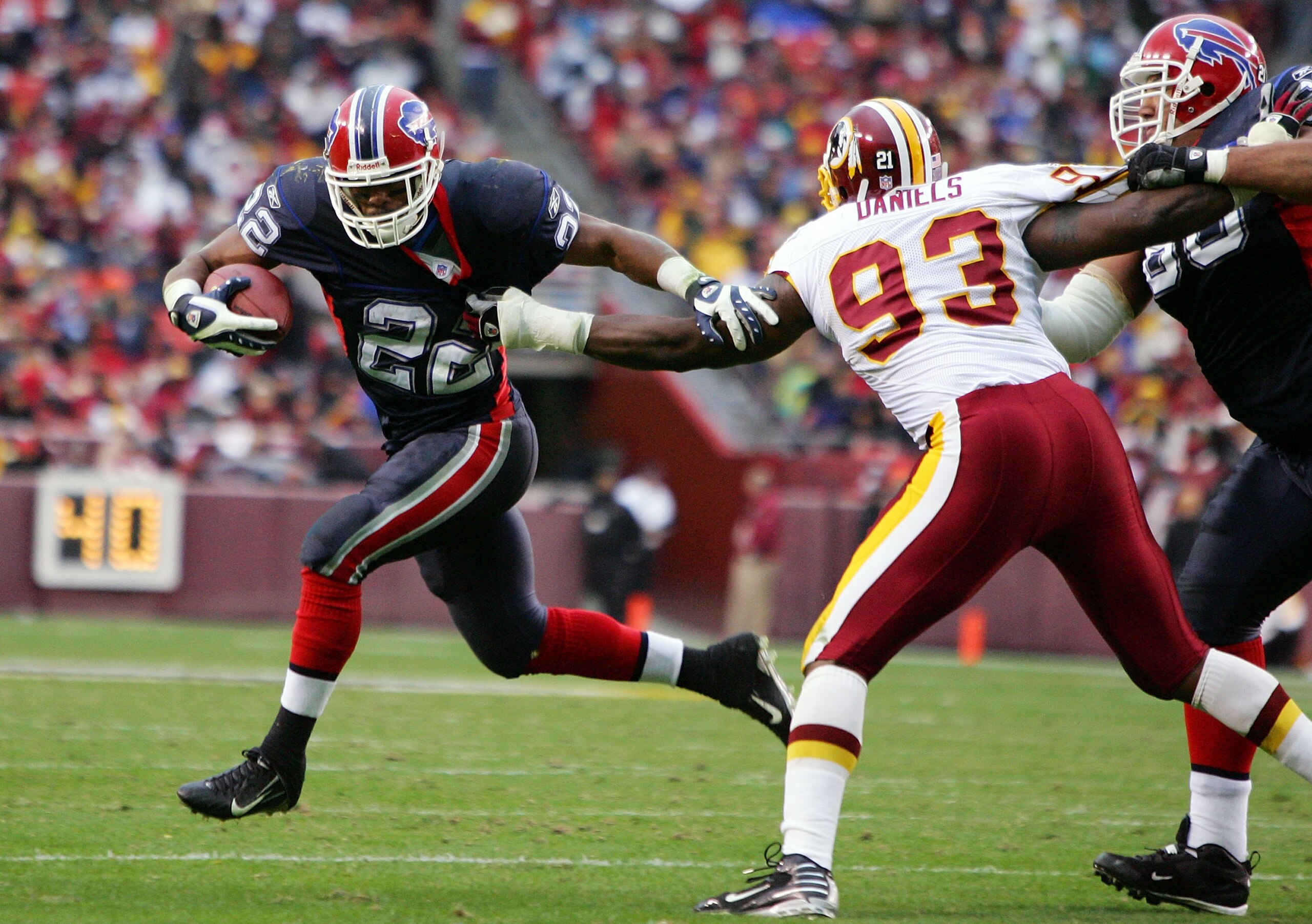 LANDOVER, MD - DECEMBER 02:  Fred Jackson #22 of the Buffalo Bills runs the ball against Phillip Daniels #93 of the Washington Redskins during their game on December 2, 2007 at FedEx Field in Landover, Maryland.  (Photo by Jim McIsaac/Getty Images)