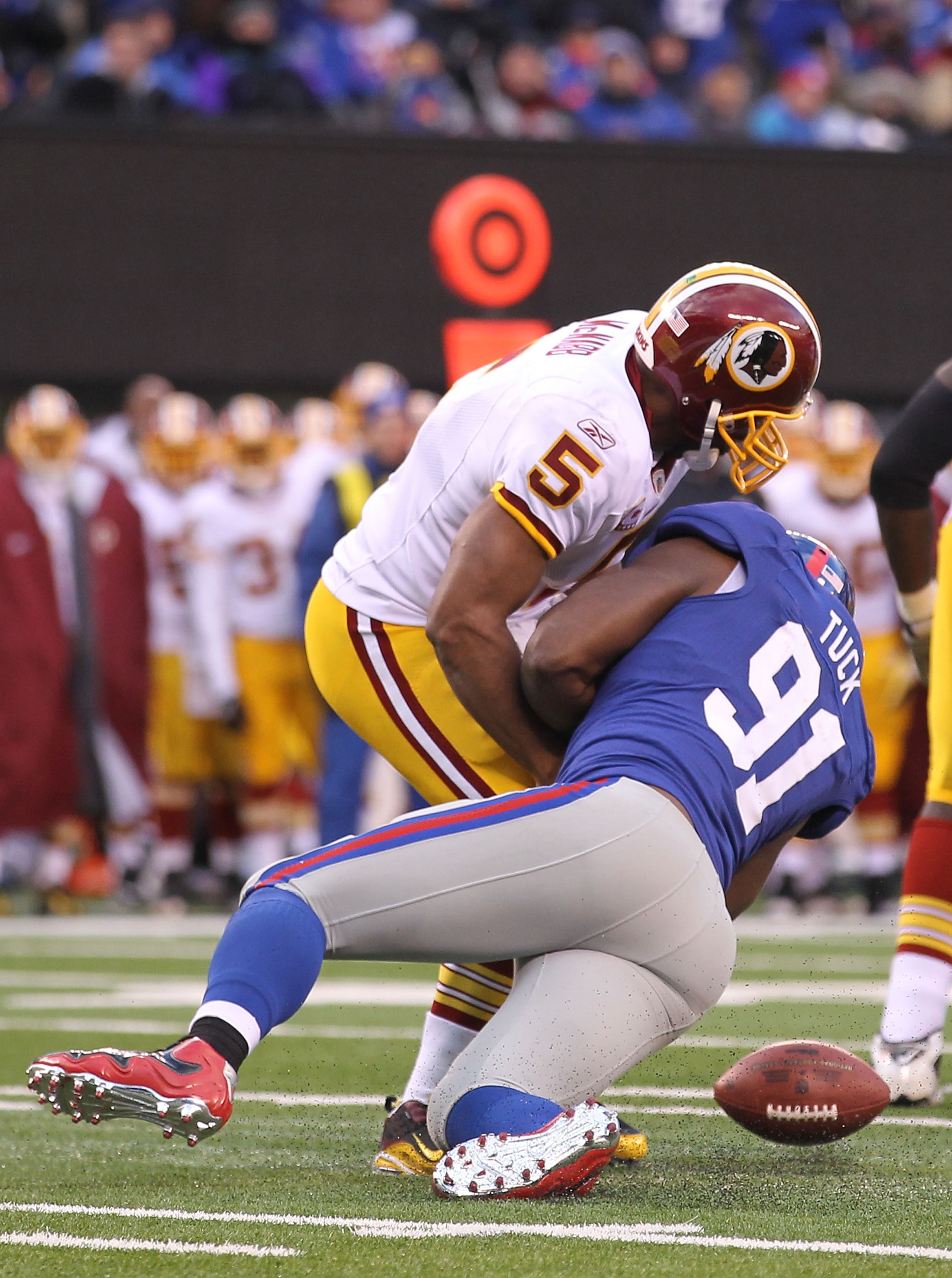 EAST RUTHERFORD, NJ - DECEMBER 05: Justin Tuck #91 of the New York Giants sacks Donovan McNabb #5 of the Washington Redskins who fumbles and loses the ball during their game on December 5, 2010 at The New Meadowlands Stadium in East Rutherford, New Jerse EAST RUTHERFORD, NJ - DECEMBER 05: Justin Tuck #91 of the New York Giants sacks Donovan McNabb #5 of the Washington Redskins who fumbles and loses the ball during their game on December 5, 2010 at The New Meadowlands Stadium in East Rutherford, New Jerse
