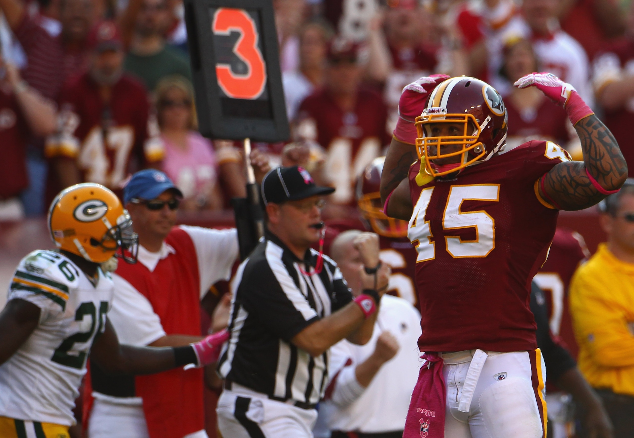 LANDOVER, MD - OCTOBER 10:  Fullback Mike Sellers #45 of the Washington Redskins flexes after officials called a penalty on a key third down play in overtime against the Green Bay Packers at FedExField on October 10, 2010 in Landover, Maryland. The Redski