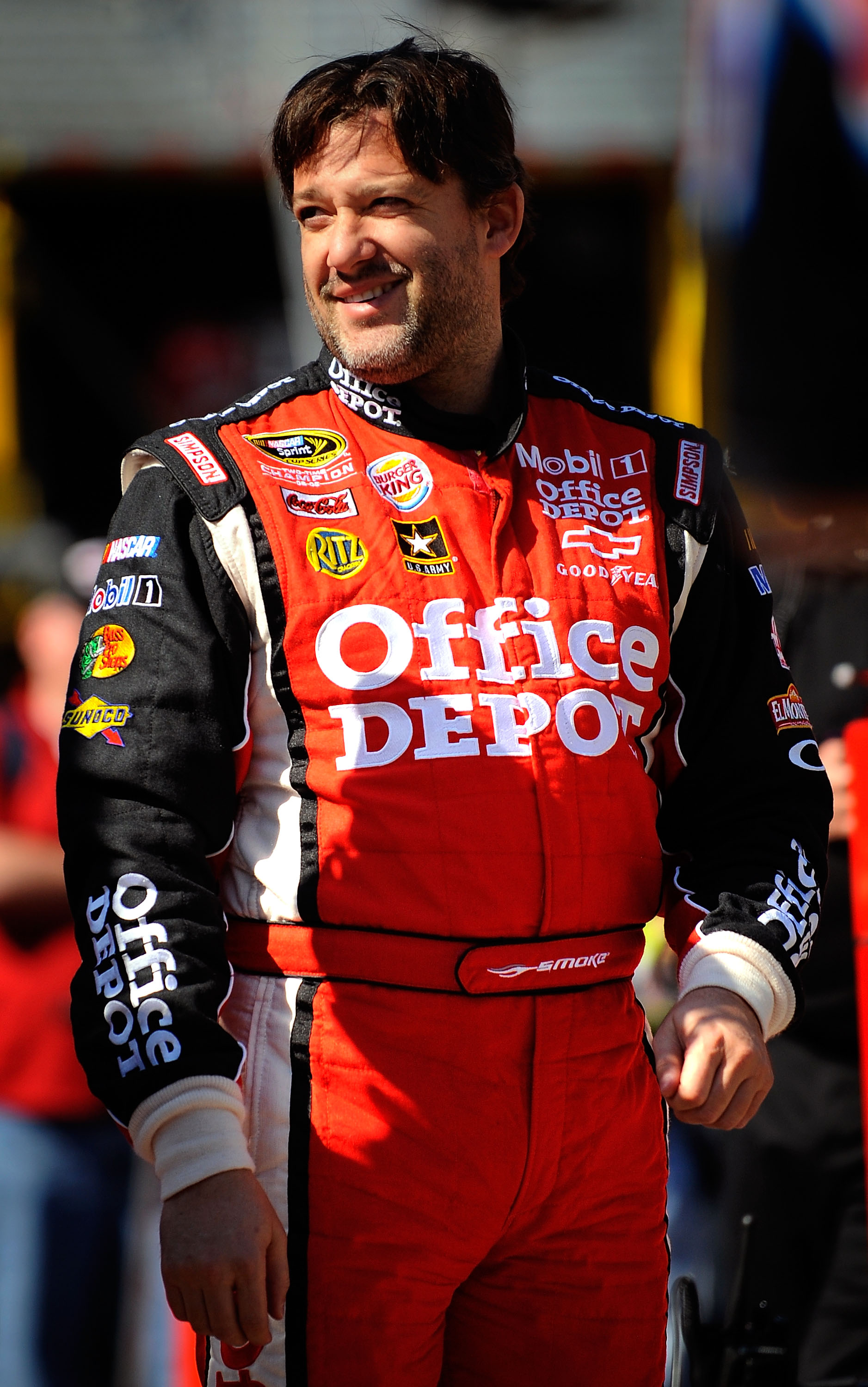 BRISTOL, TN - MARCH 19:  Tony Stewart, driver of the #14 Office Depot/Mobil 1 Chevrolet, walks in the garage area during practice for the NASCAR Sprint Cup Series Jeff Byrd 500 Presented By Food City at Bristol Motor Speedway on March 19, 2011 in Bristol,