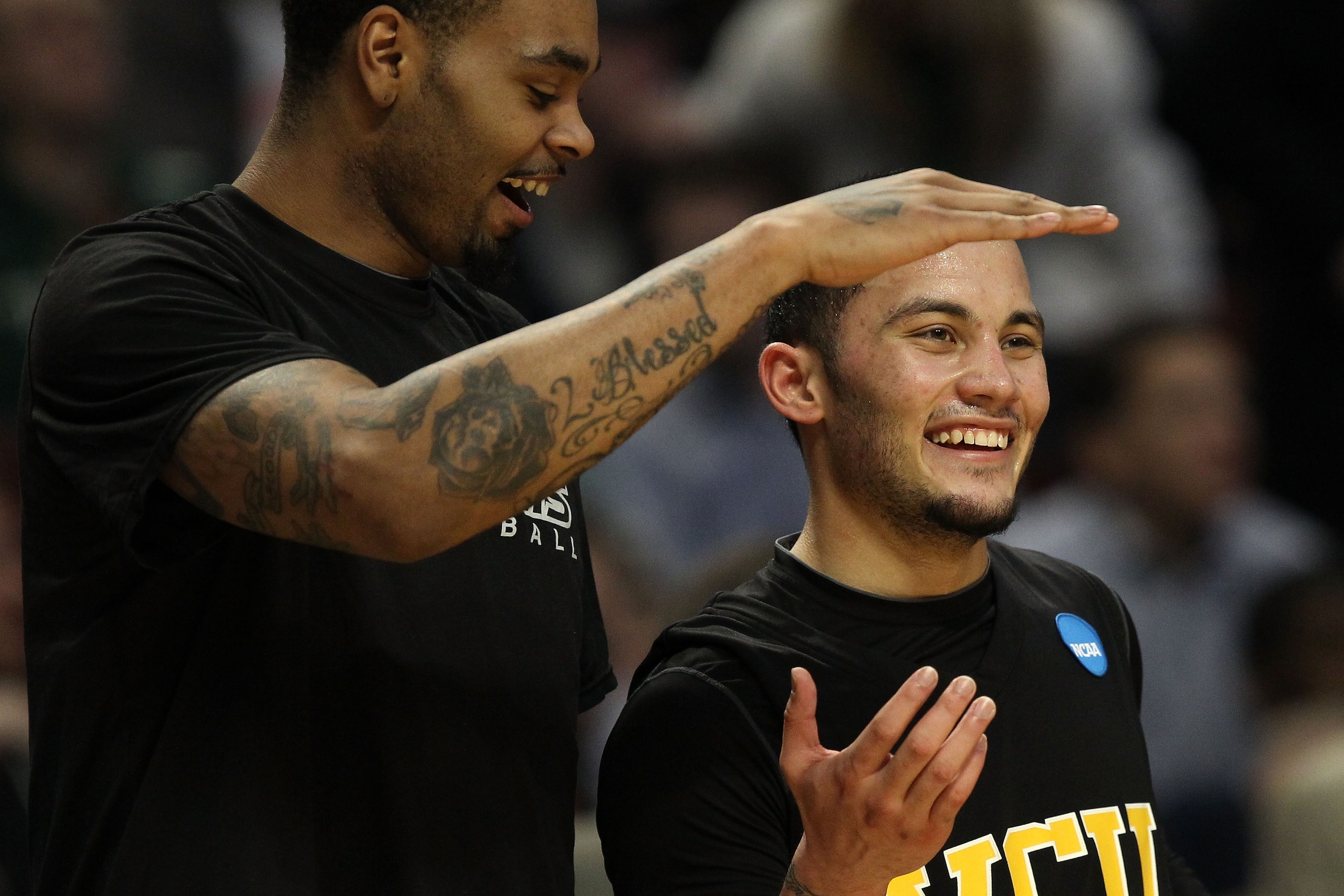 CHICAGO, IL - MARCH 20:  Joey Rodriguez #12 of the Virginia Commonwealth Rams celebrates with teammate Toby Veal #31 in the second half against the Purdue Boilermakers during the third round of the 2011 NCAA men's basketball tournament at the United Cente