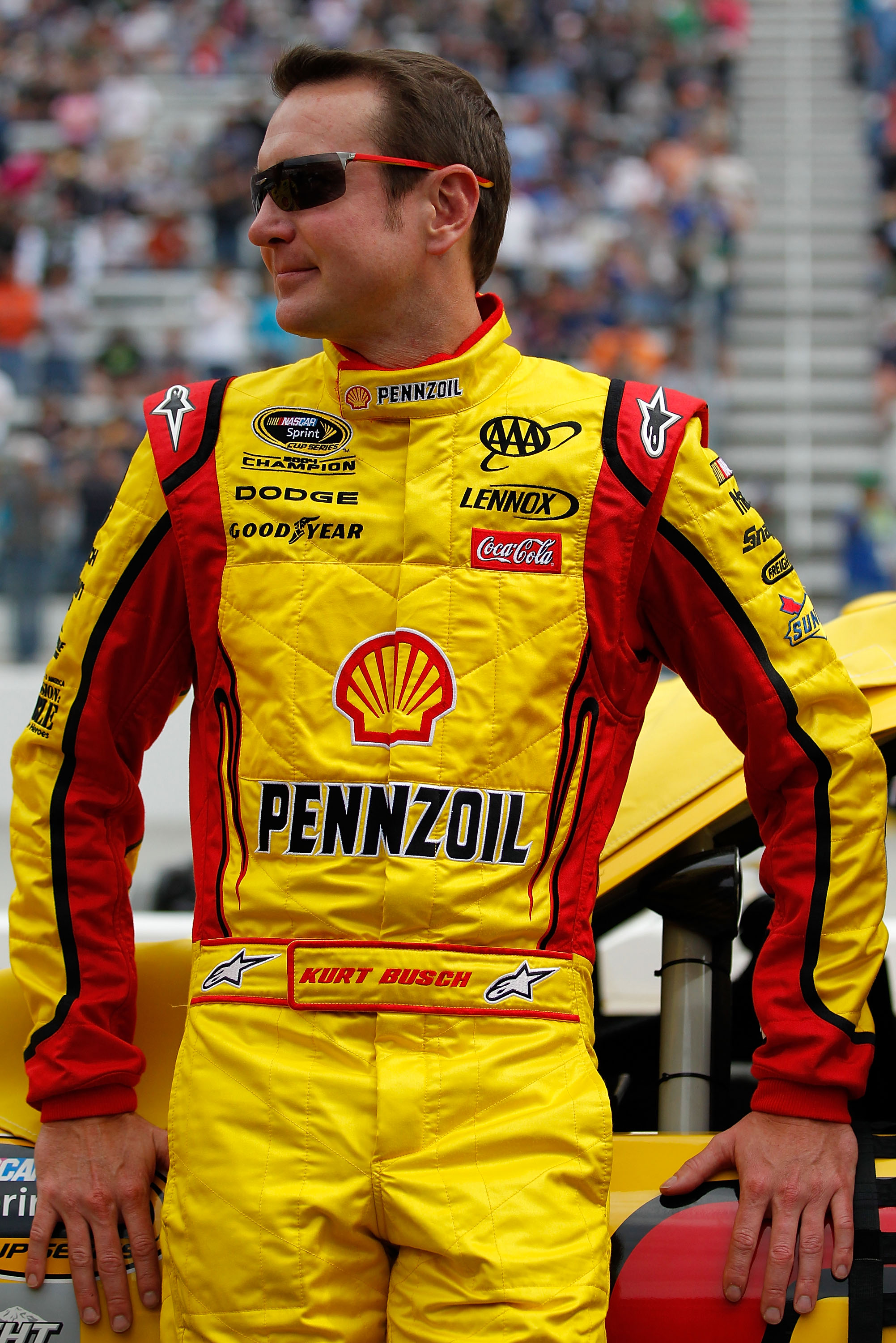 BRISTOL, TN - MARCH 20: Kurt Busch, driver of the #22 Shell/Pennzoil Dodge, stands on the grid prior to the start of the NASCAR Sprint Cup Series Jeff Byrd 500 Presented By Food City at Bristol Motor Speedway on March 20, 2011 in Bristol, Tennessee.  (Pho