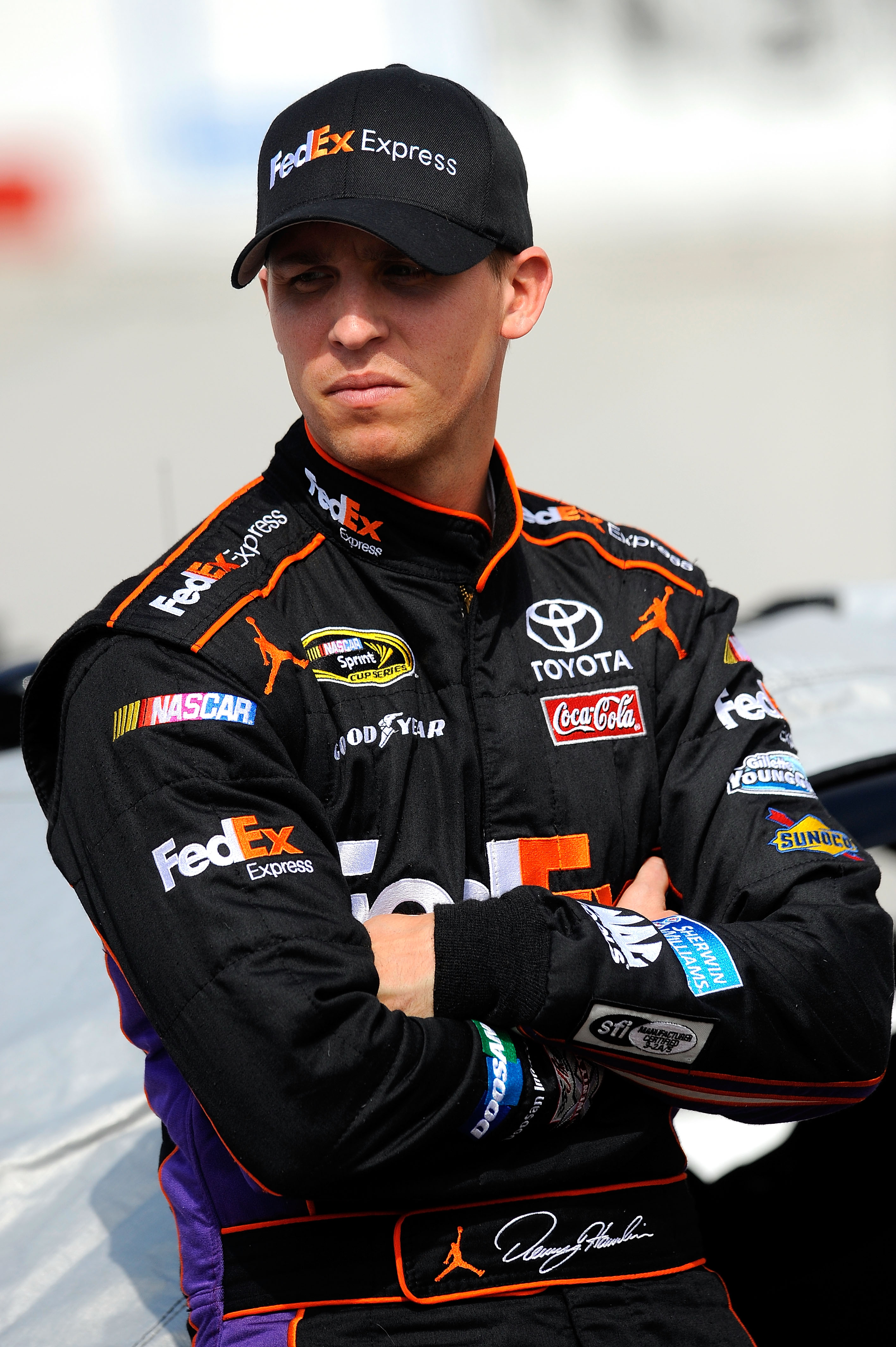 BRISTOL, TN - MARCH 18:  Denny Hamlin, driver of the #11 FedEx Express Toyota, stands on the grid prior to qualifying for the NASCAR Sprint Cup Series Jeff Byrd 500 Presented By Food City at Bristol Motor Speedway on March 18, 2011 in Bristol, Tennessee.