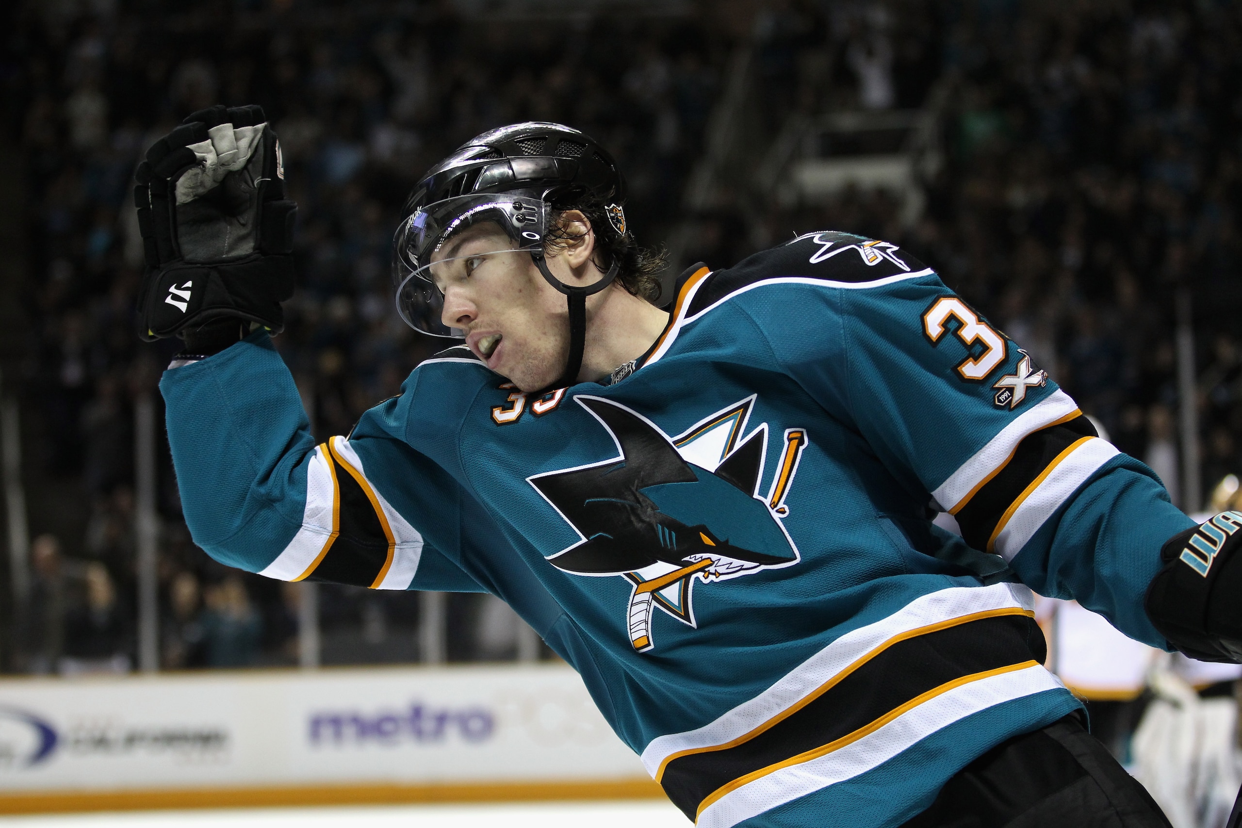 SAN JOSE, CA - MARCH 23:  Logan Couture #39 of the San Jose Sharks celebrates after he scored a goal against the Calgary Flames at the HP Pavilion on March 23, 2011 in San Jose, California.  (Photo by Ezra Shaw/Getty Images)