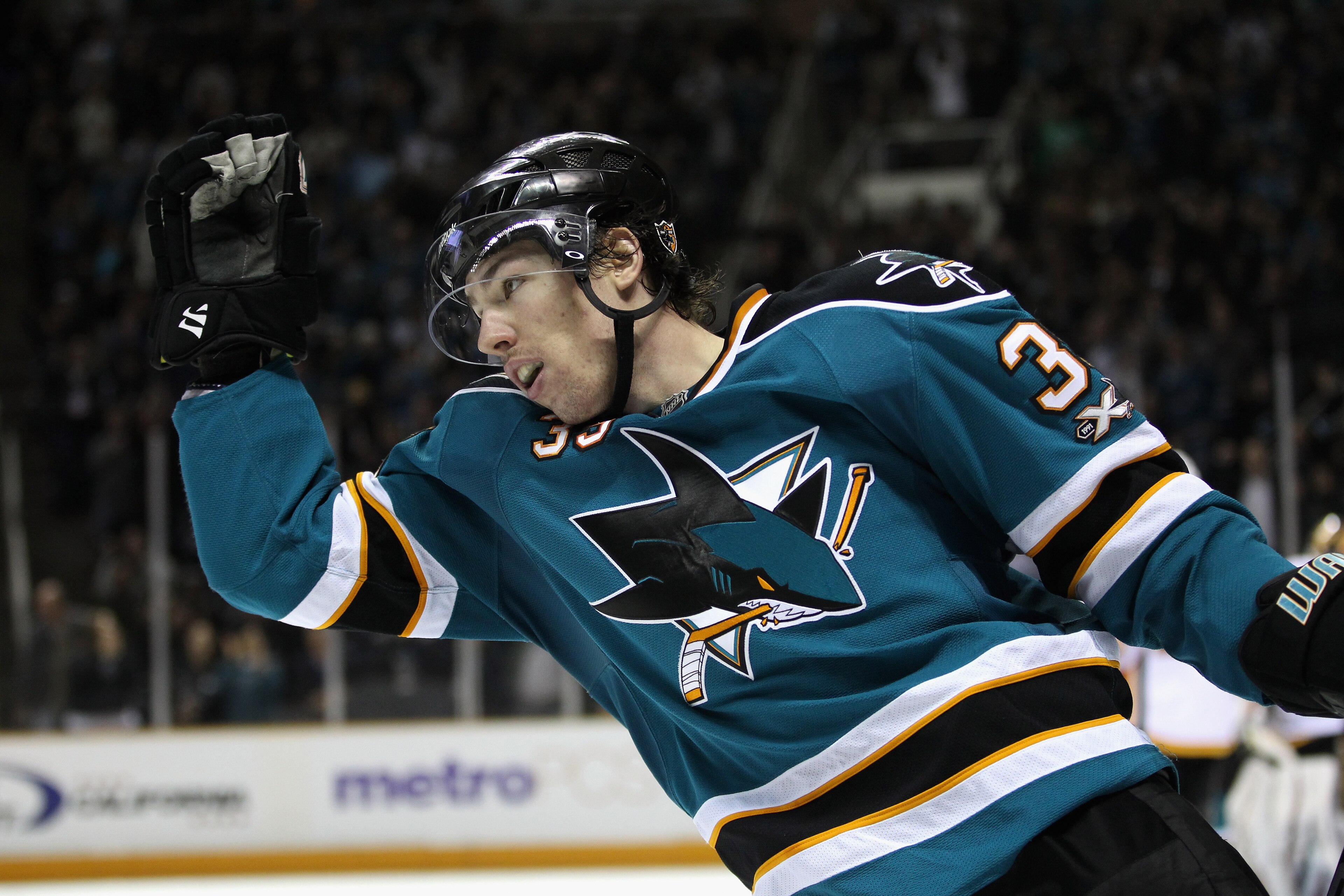 SAN JOSE, CA - MARCH 23:  Logan Couture #39 of the San Jose Sharks celebrates after he scored a goal against the Calgary Flames at the HP Pavilion on March 23, 2011 in San Jose, California.  (Photo by Ezra Shaw/Getty Images)