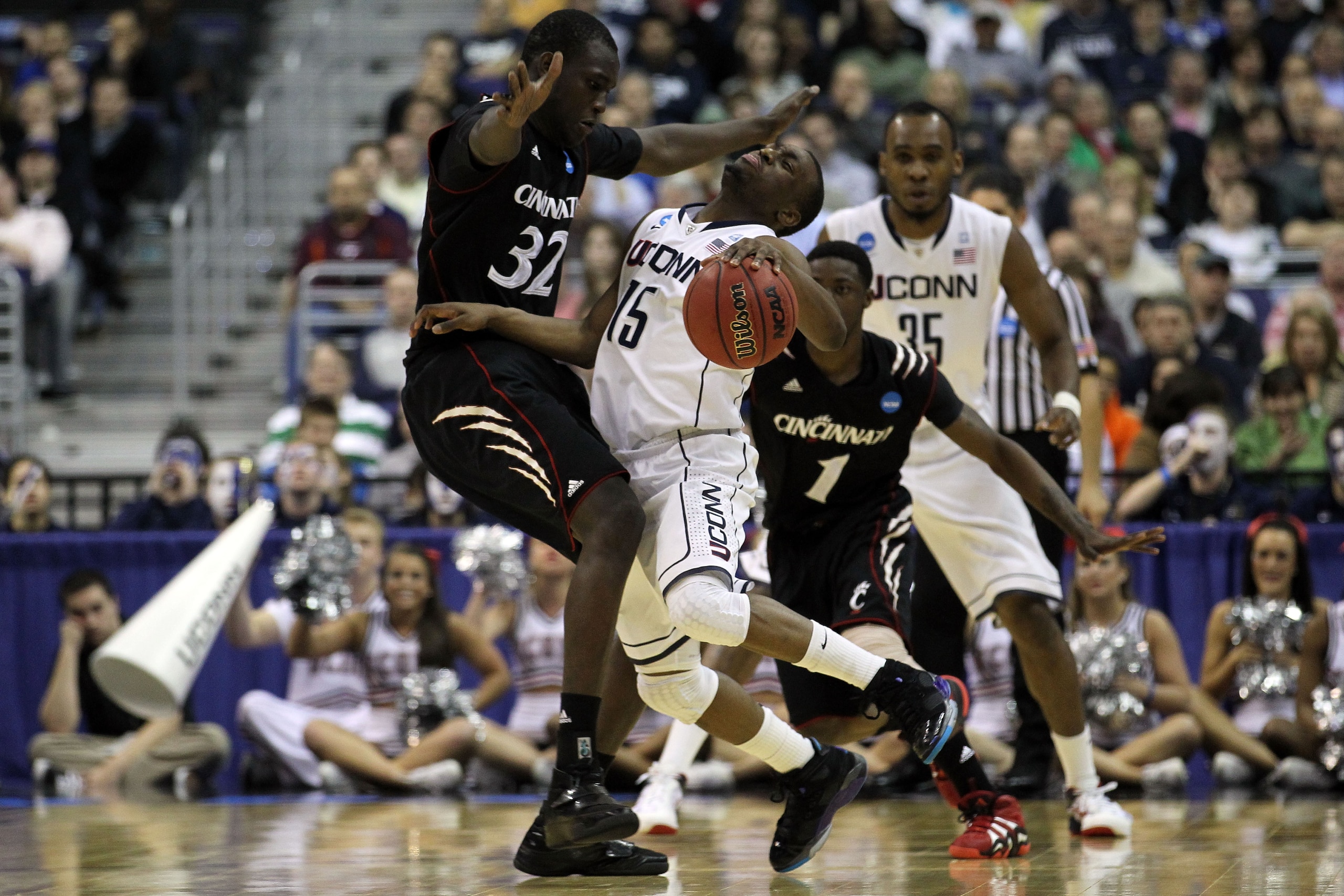 WASHINGTON - MARCH 19: Kemba Walker #15 of the Connecticut Huskies collides with Ibrahima Thomas #32 of the Cincinnati Bearcats during the third round of the 2011 NCAA men's basketball tournament at Verizon Center on March 19, 2011 in Washington, DC. (P WASHINGTON - MARCH 19: Kemba Walker #15 of the Connecticut Huskies collides with Ibrahima Thomas #32 of the Cincinnati Bearcats during the third round of the 2011 NCAA men's basketball tournament at Verizon Center on March 19, 2011 in Washington, DC. (P