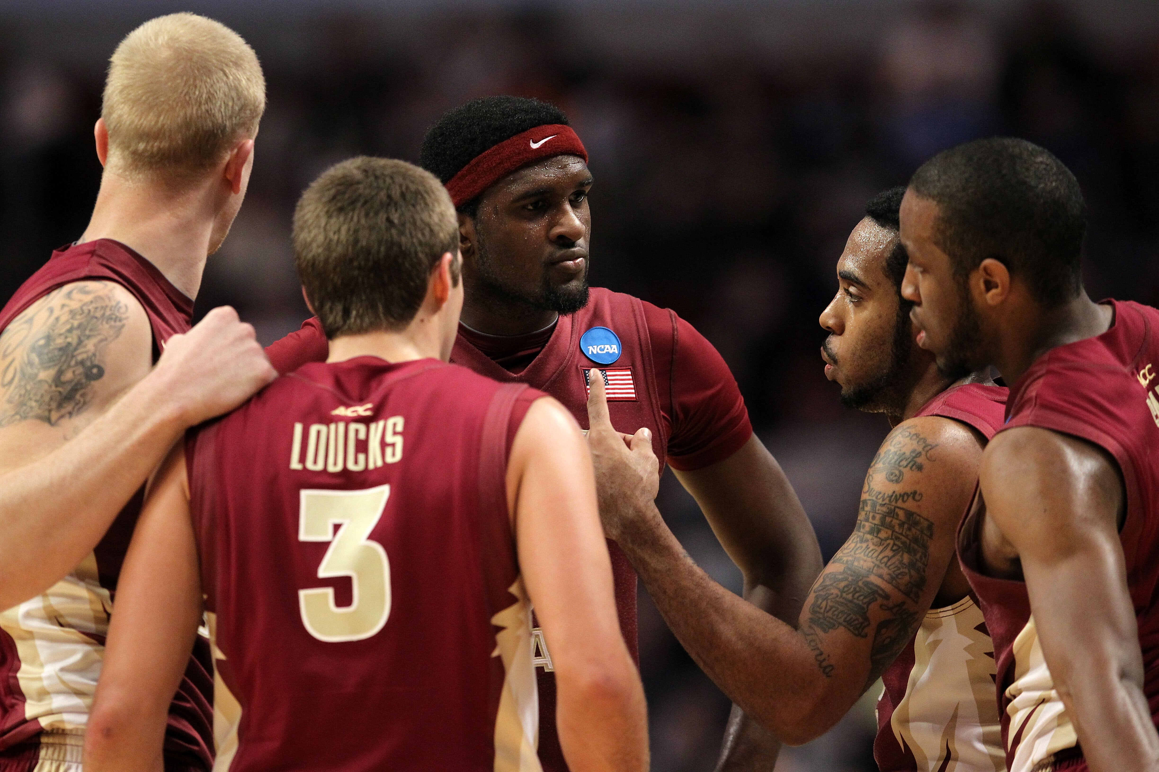 CHICAGO, IL - MARCH 20:  Chris Singleton #31, Luke Loucks #3, Derwin Kitchen #22, Jon Kreft #50 and Michael Snaer #21 of the Florida State Seminoles talk in the second half against the Notre Dame Fighting Irish during the third round of the 2011 NCAA men'