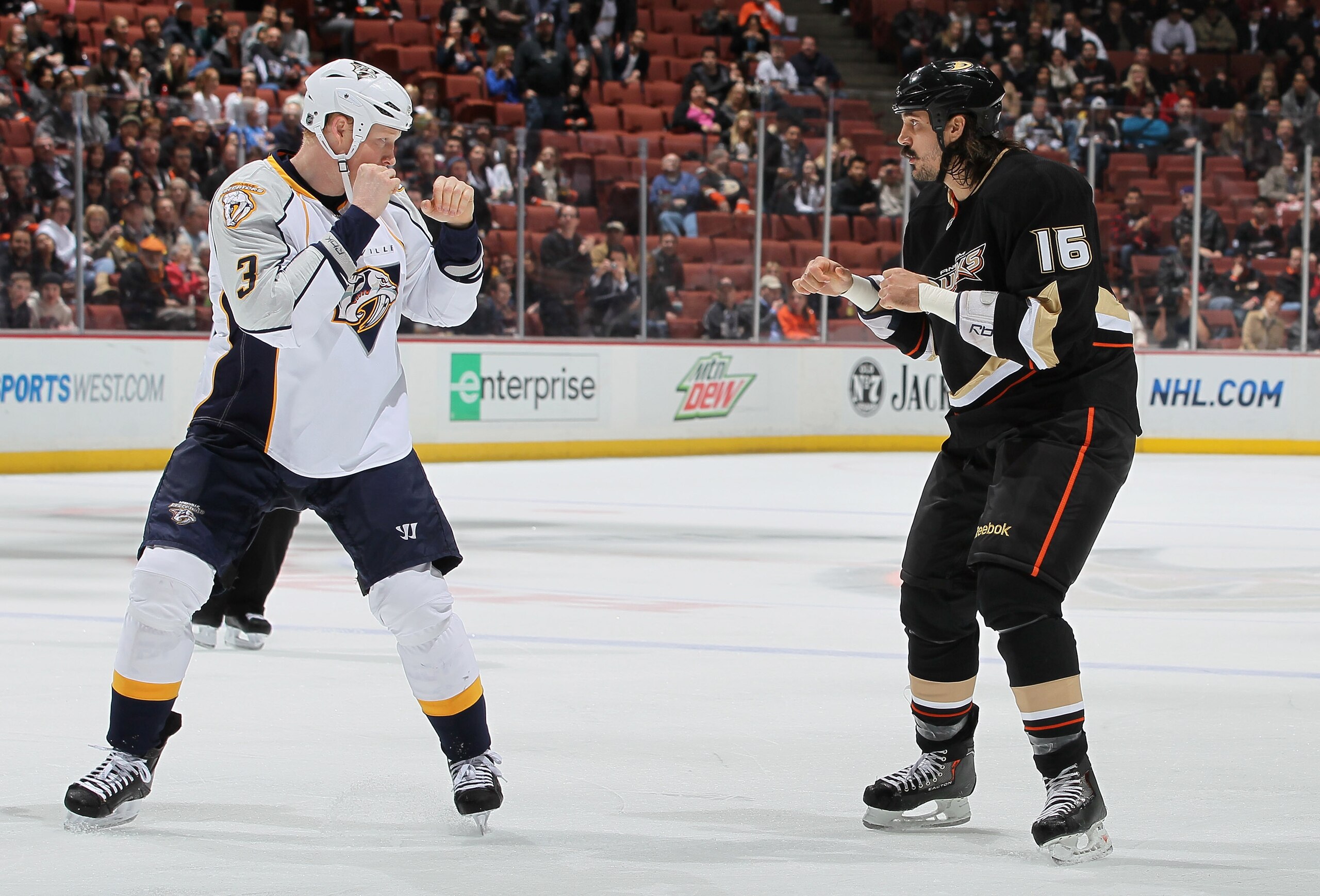 ANAHEIM, CA - JANUARY 05:  Wade Belak #5 of the Nashville Predators and George Parros #16 of the Anaheim Ducks square off to fight in the first period at the Honda Center on January 5, 2011 in Anaheim, California.  (Photo by Jeff Gross/Getty Images)