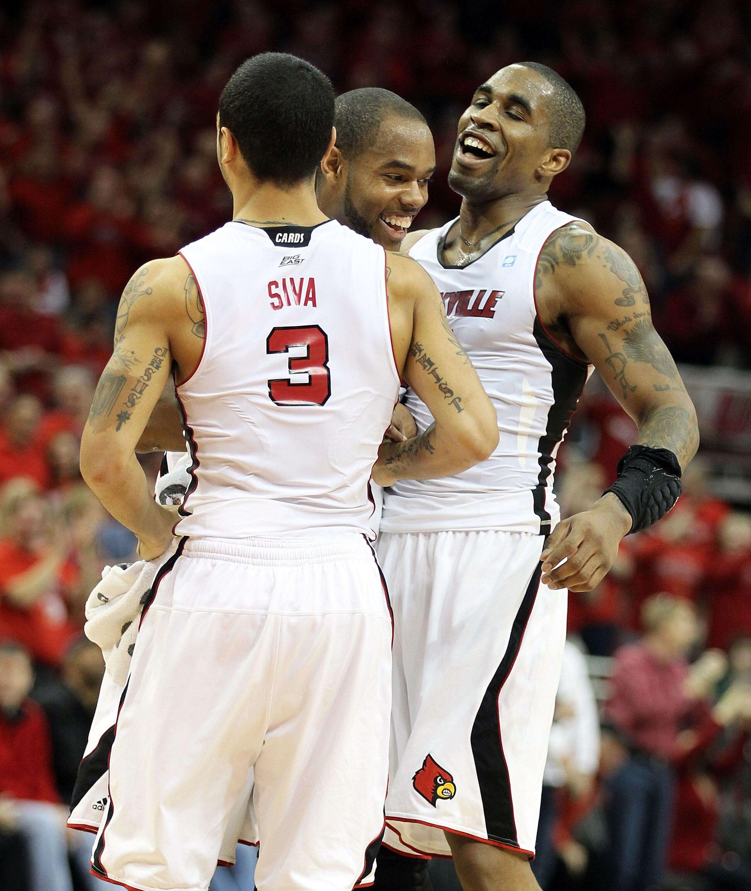 LOUISVILLE, KY - MARCH 02: Preston Knowles #2 (Center) of the Louisville Cardinals celebrates with Peyton Siva #3 and Chris Smith #5 after making a basket to end the first half during the Big East Conference game against the Providence Friars at the KFC LOUISVILLE, KY - MARCH 02: Preston Knowles #2 (Center) of the Louisville Cardinals celebrates with Peyton Siva #3 and Chris Smith #5 after making a basket to end the first half during the Big East Conference game against the Providence Friars at the KFC