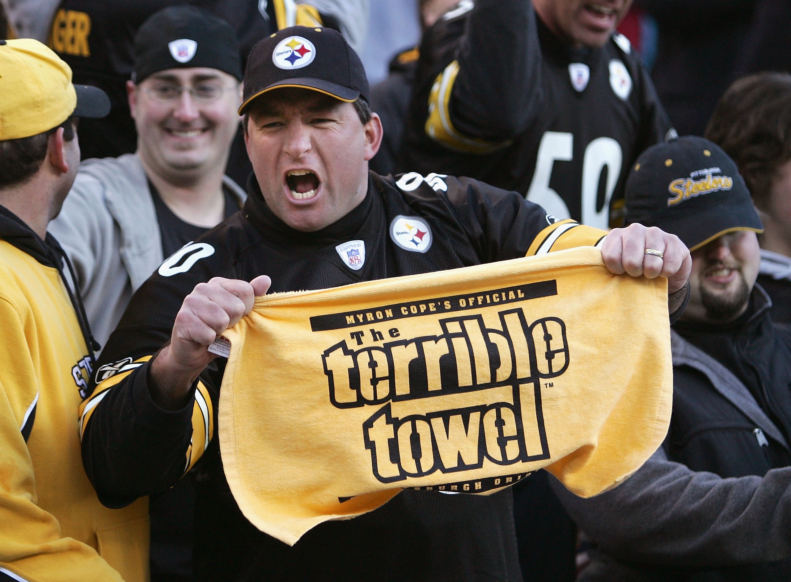 DENVER - JANUARY 22:  A fan of the Pittsburgh Steelers celebrates with a 'terrible towel' after the Steelers defeated the Denver Broncos in the AFC Championship Game on January 22, 2006 at Invesco Field at Mile High in Denver, Colorado.  The Steelers defe
