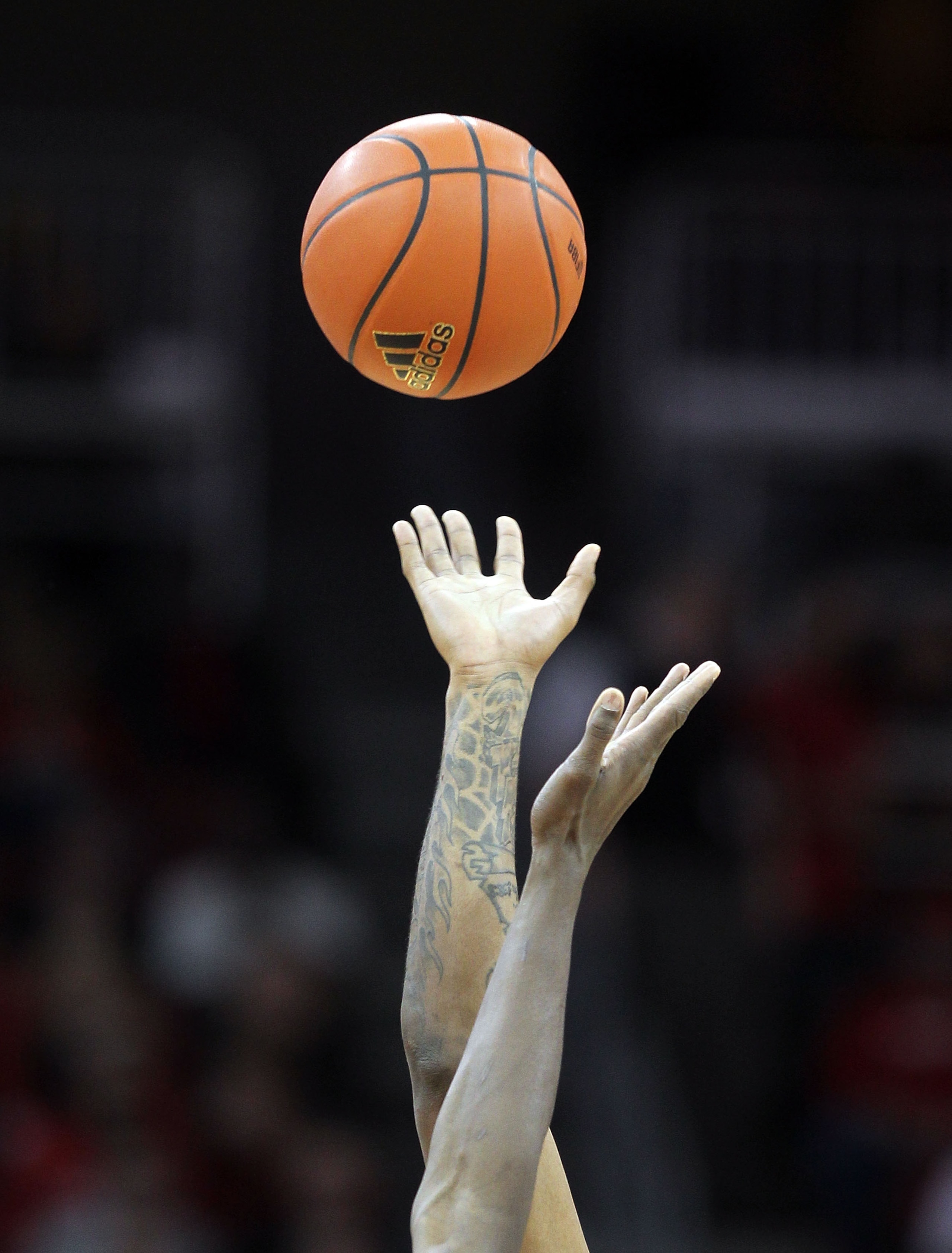 LOUISVILLE, KY - FEBRUARY 12: The opening tip of the Louisville Cardinals Big East Conference game against the Syracuse Orange at the KFC Yum! Center on February 12, 2011 in Louisville, Kentucky. (Photo by Andy Lyons/Getty Images) LOUISVILLE, KY - FEBRUARY 12: The opening tip of the Louisville Cardinals Big East Conference game against the Syracuse Orange at the KFC Yum! Center on February 12, 2011 in Louisville, Kentucky. (Photo by Andy Lyons/Getty Images)