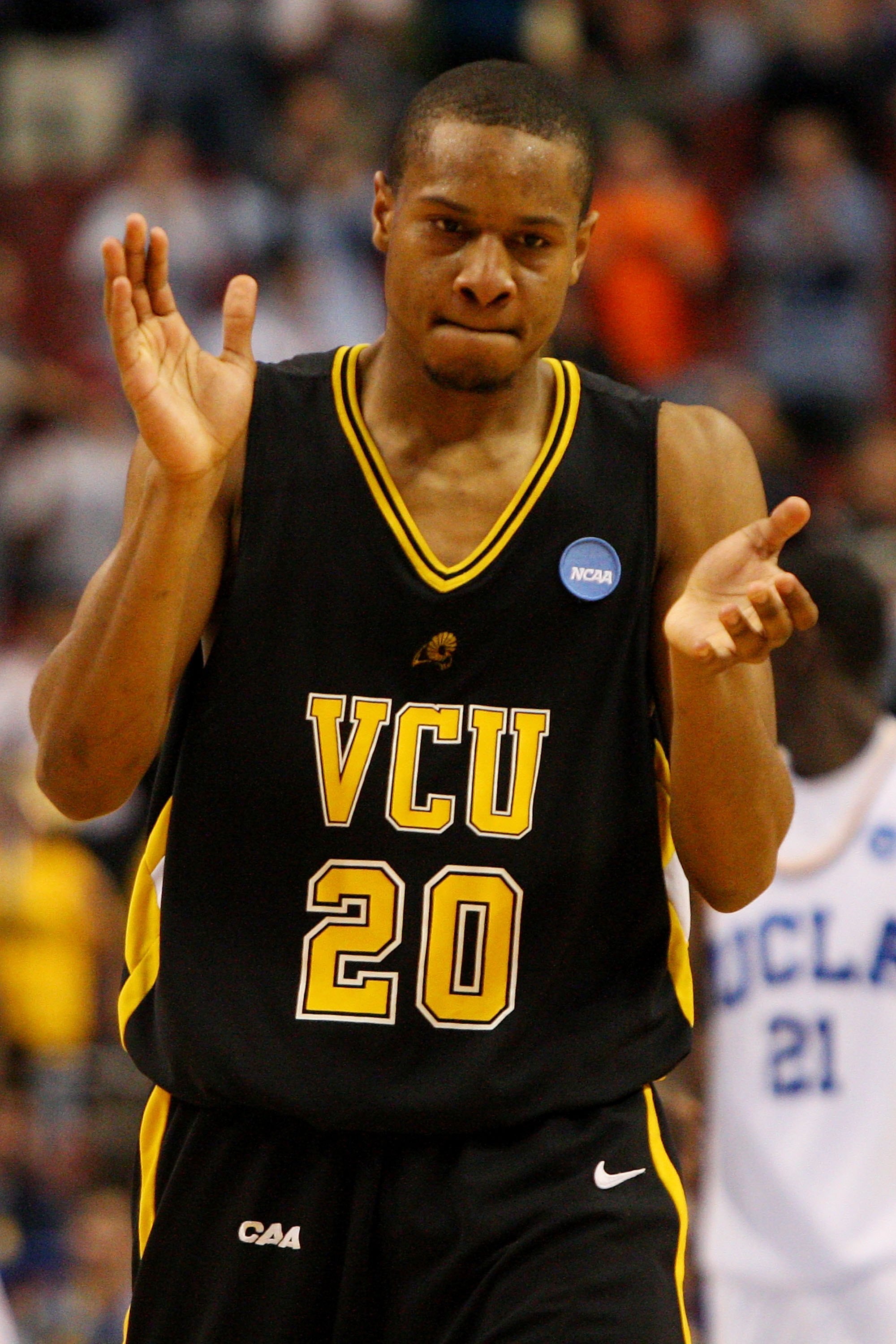 PHILADELPHIA - MARCH 19:  Bradford Burgess #20 of the VCU Rams cheers during the game against the UCLA Bruins during the first round of the NCAA Division I Men's Basketball Tournament at the Wachovia Center on March 19, 2009 in Philadelphia, Pennsylvania.