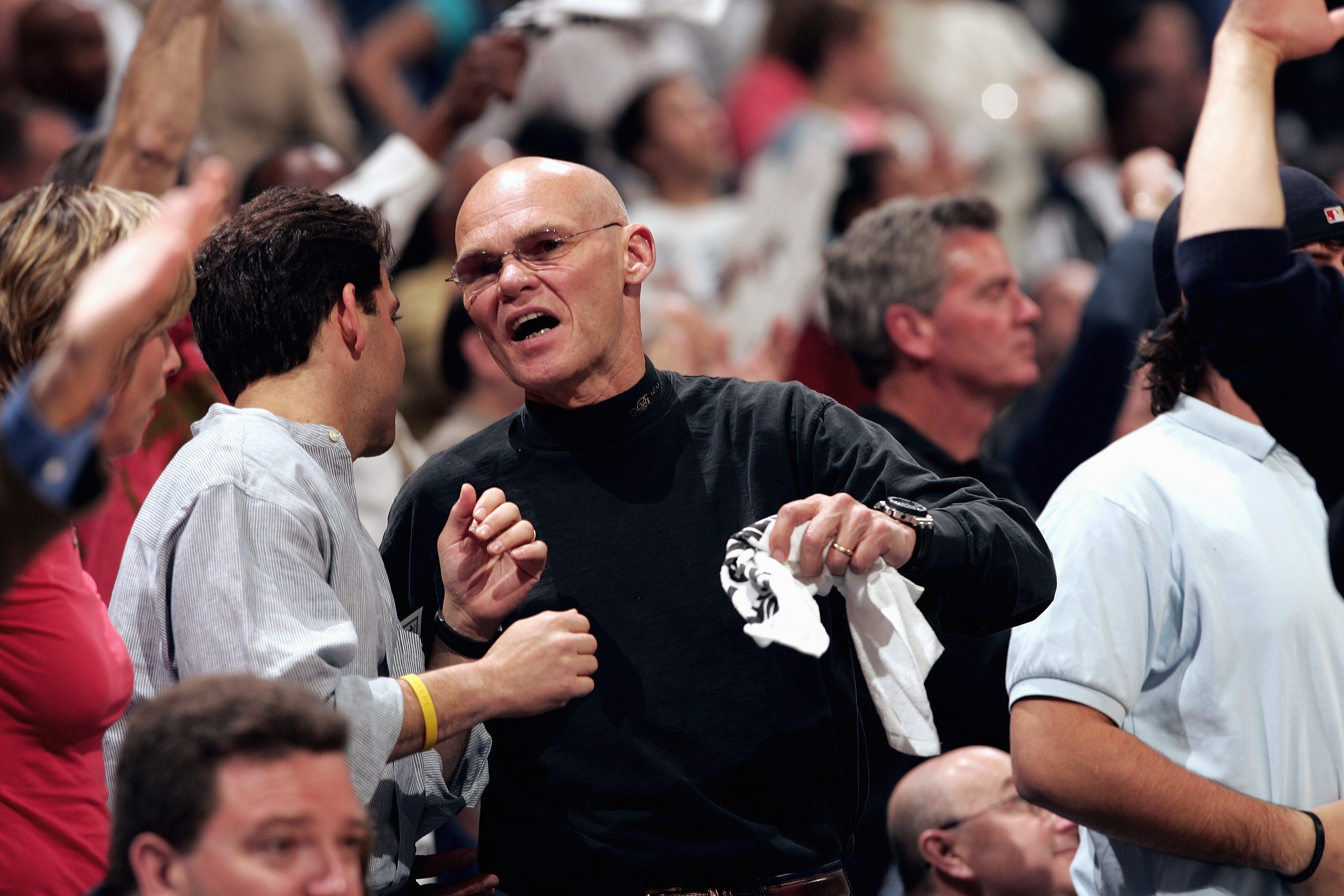 WAHINGTON DC - MAY 6:  Political consultant James Carville talks with a fan during Game five of the Eastern Conference Quarterfinals between the Chicago Bulls and the Washington Wizards in the 2005 NBA Playoffs at the United Center on May 4, 2005 in Chica
