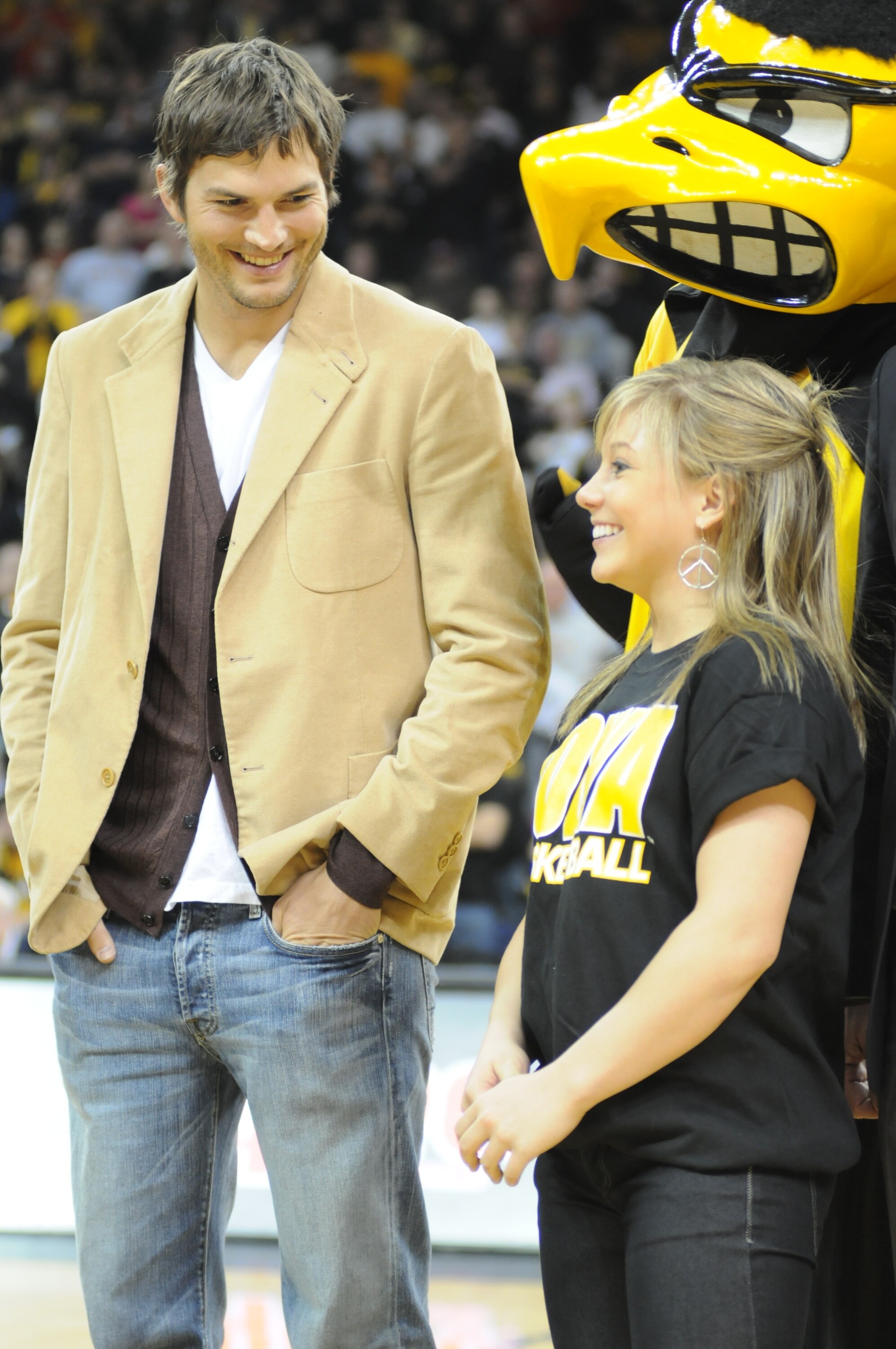 IOWA CITY, IA - DECEMBER 12: Olympic medalist Shawn Johnson (R) and actor Ashton Kutcher are honored during halftime of the Iowa-Iowa State college basketball game on December 12, 2008 at the University of Iowa in Iowa City, Iowa. Johnson and Kutcher, bot