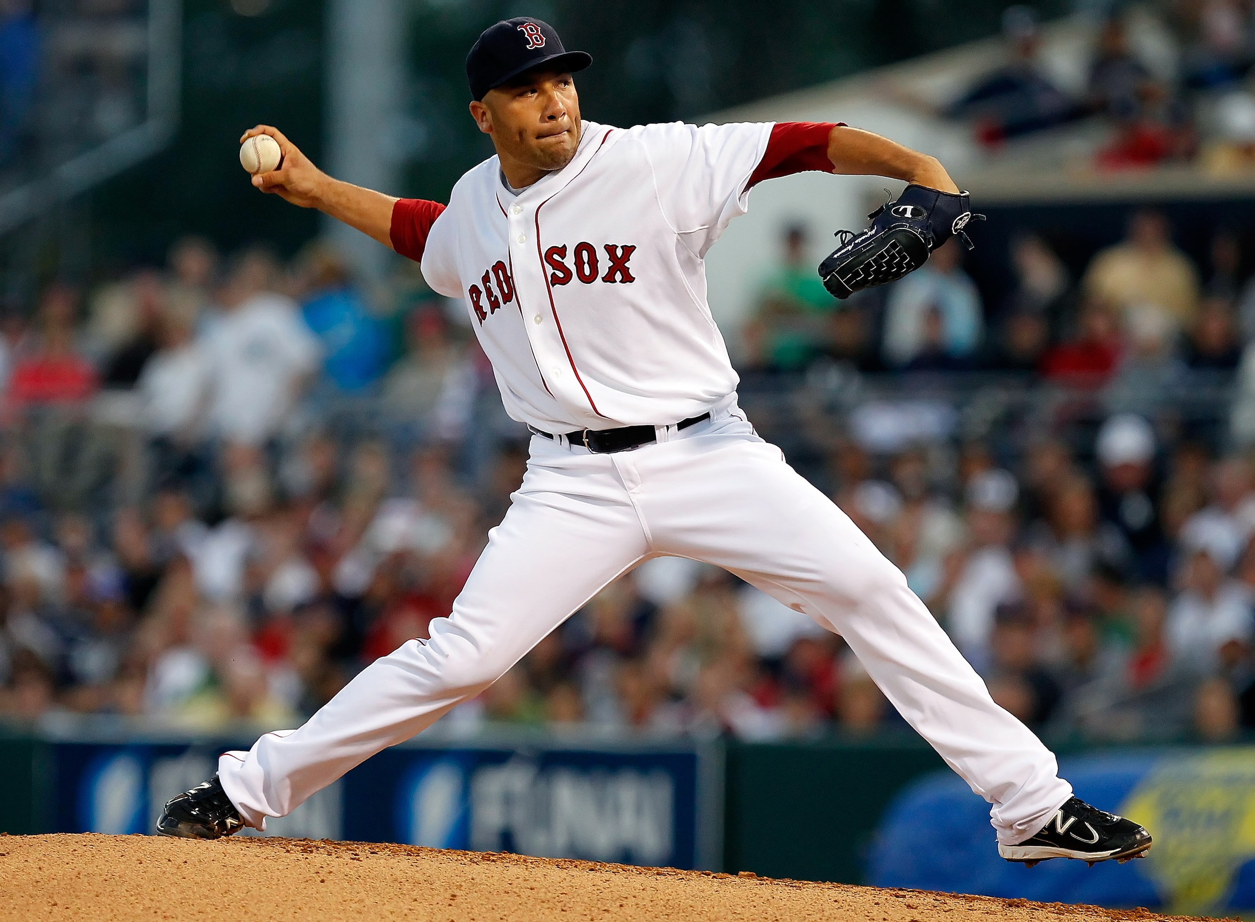 FORT MYERS, FL - MARCH 14:  Pitcher Alfredo Aceves #91 of the Boston Red Sox pitches against the New York Yankees during a Grapefruit League Spring Training Game at City of Palms Park on March 14, 2011 in Fort Myers, Florida.  (Photo by J. Meric/Getty Ima