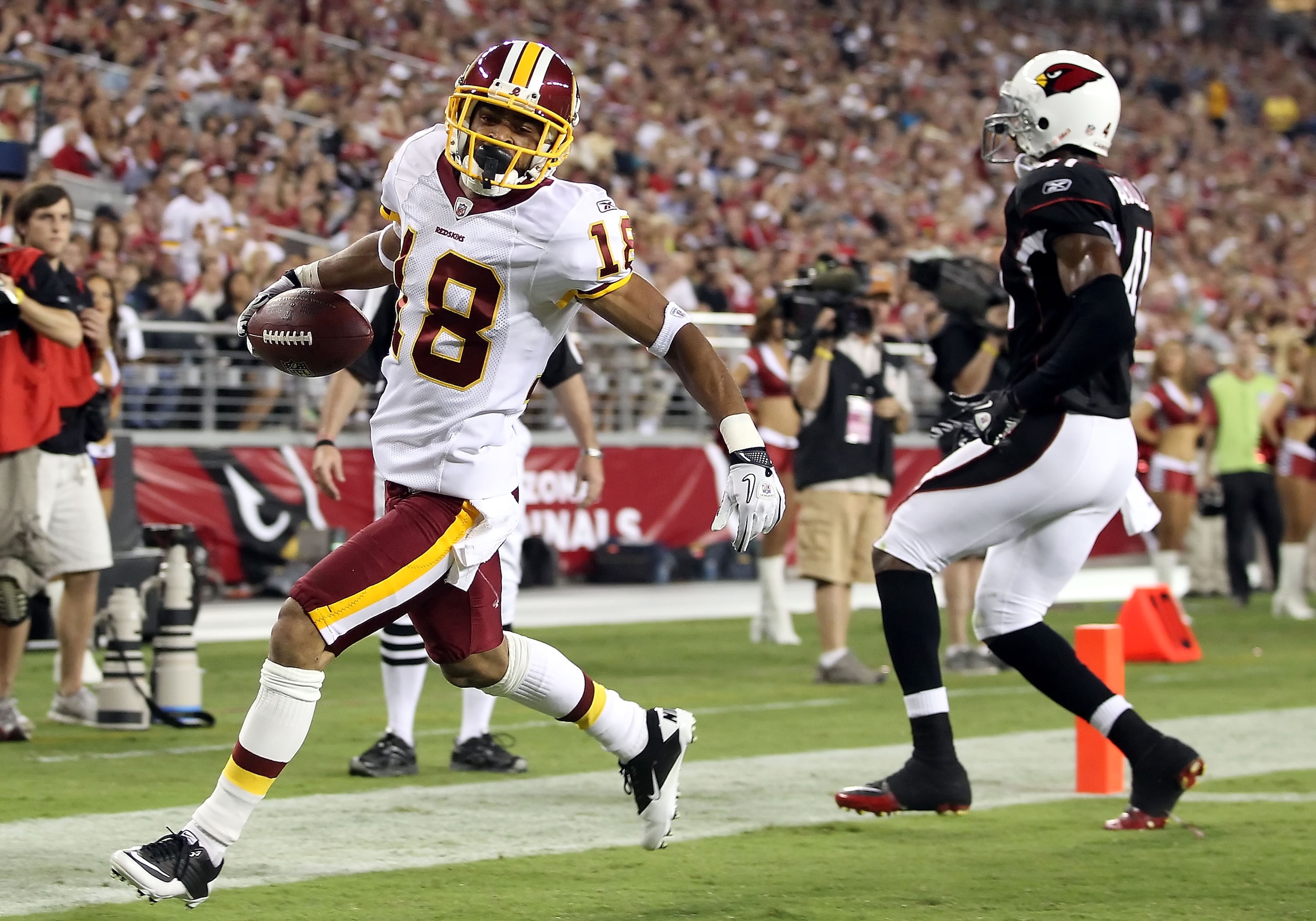 GLENDALE, AZ - SEPTEMBER 02:  Wide receiver Terrence Austin #18 of the Washington Redskins scores a 21 yard touchdown reception against the Arizona Cardinals during the fourth quarter of the preseason NFL game at the University of Phoenix Stadium on Septe