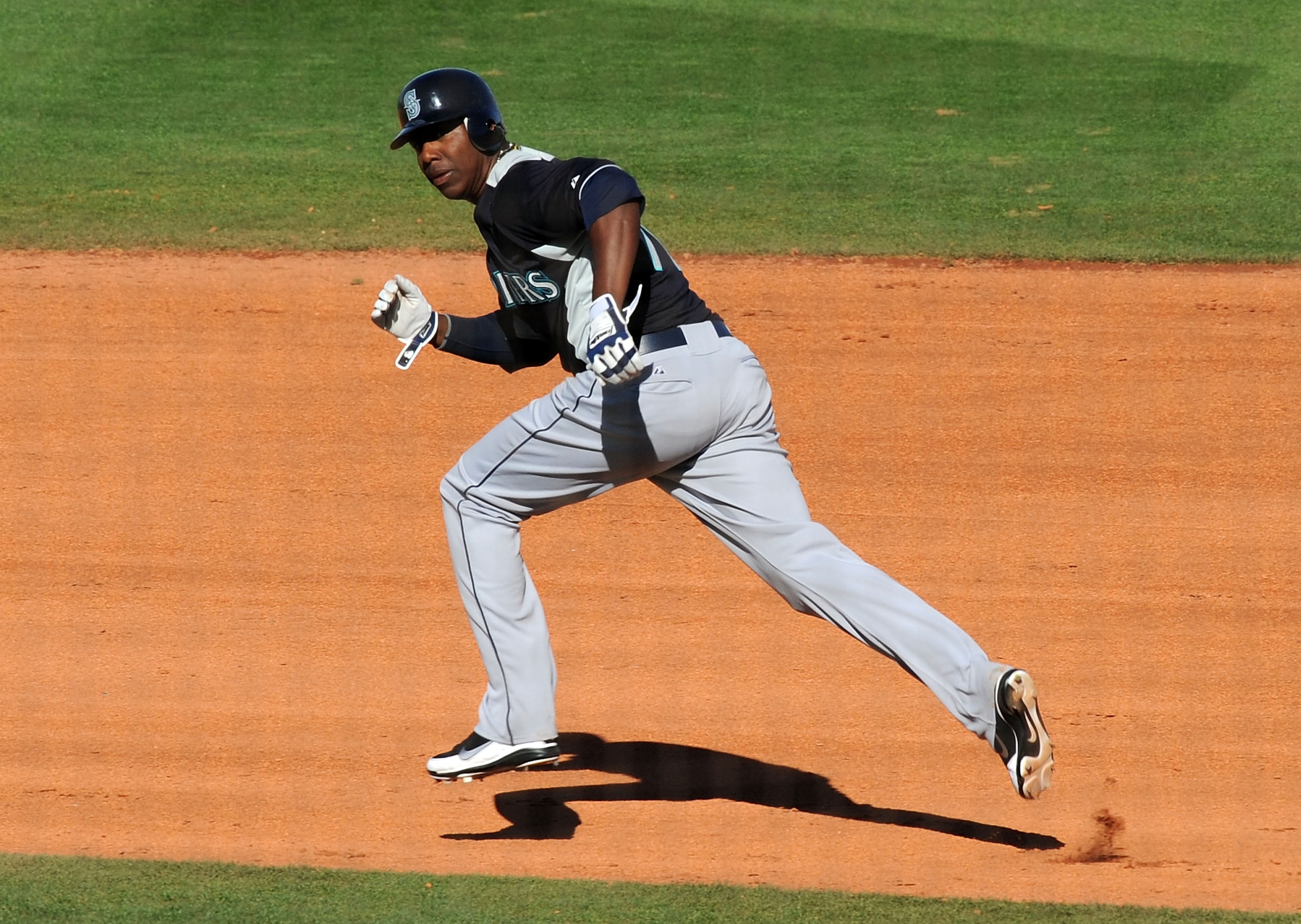 GOODYEAR, AZ - MARCH 11:  Johermyn Chavez #70 of the Seattle Mariners runs to second base while watching for the ball against the Cleveland Indians at Goodyear Ballpark on March 11, 2011 in Goodyear, Arizona.  (Photo by Norm Hall/Getty Images)