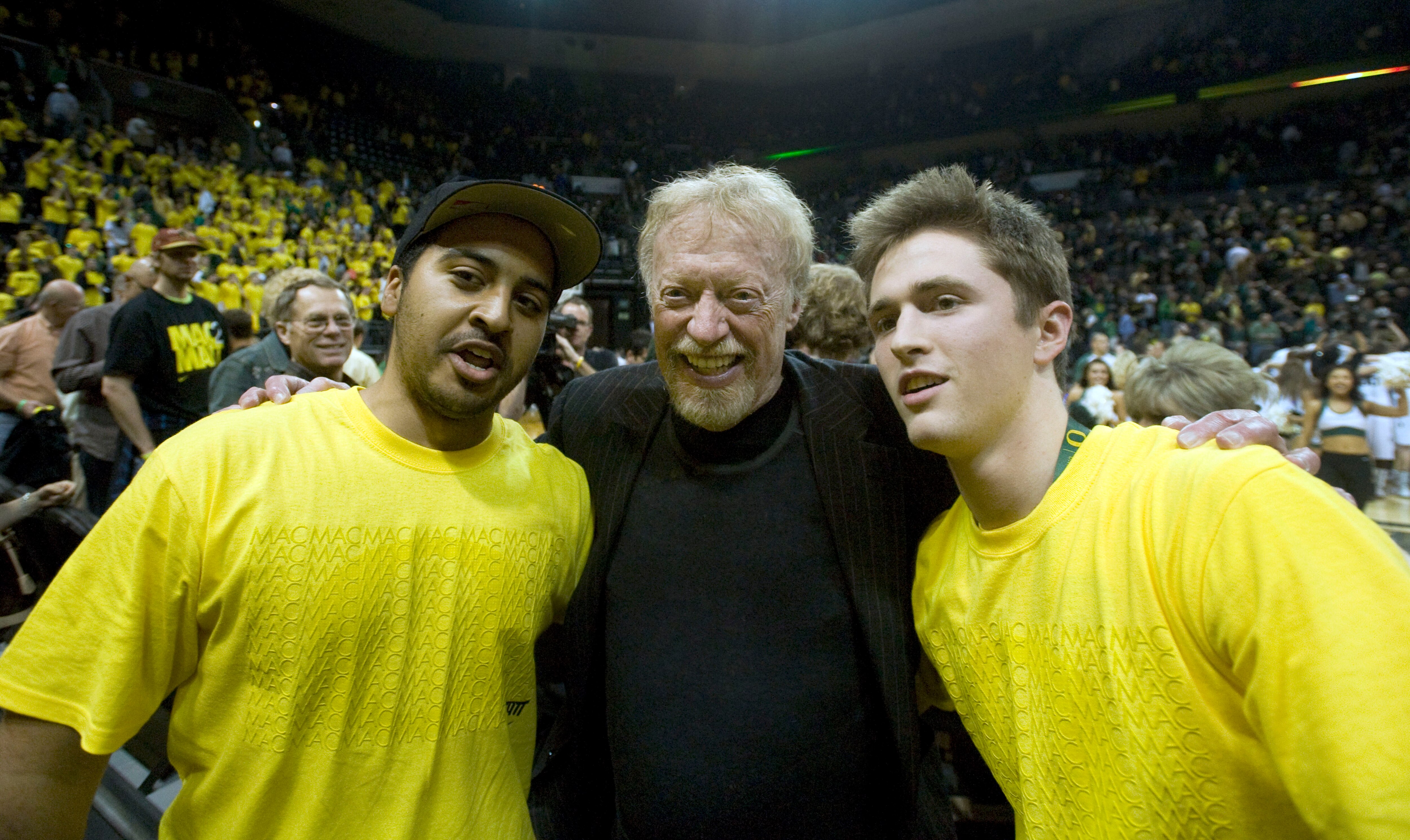 EUGENE, OR - JANUARY 13: Phil Knight, co-founder and Chairman of Nike, Inc., poses with Oregon Duck fans after the Oregon Ducks won the first game at Matthew Knight Arena against the USC Trojans 68-62 on January 13, 2011 in Eugene, Oregon. The arena is na