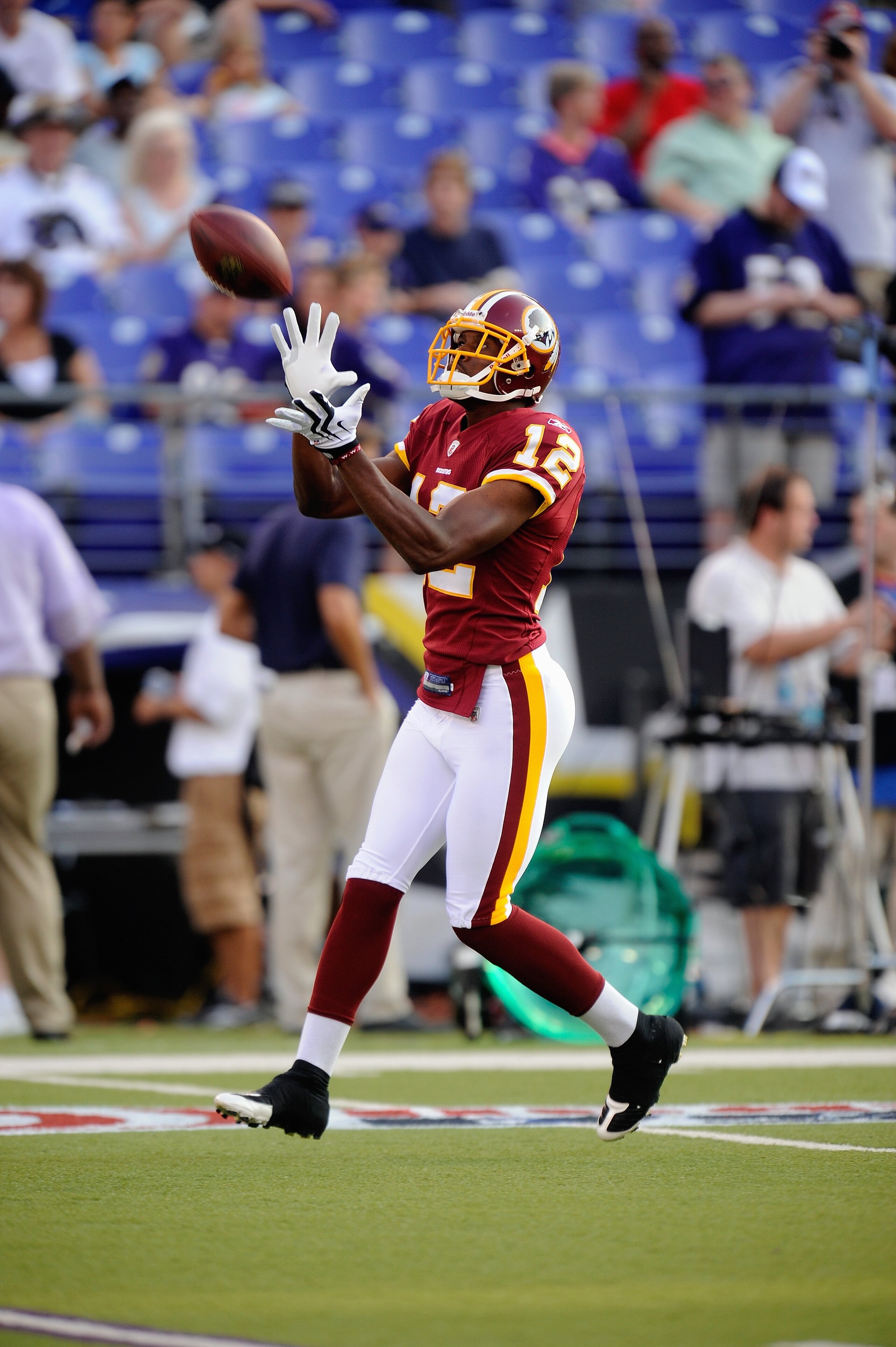 BALTIMORE, MD - AUGUST 13:  Malcolm  Kelly #12 of the Washington Redskins makes a catch during warm ups of a NFL preseason football game against the Baltimore Ravens on August 13, 2009 at M & T Bank Stadium in Baltimore, Maryland.   (Photo by Mitchell Lay