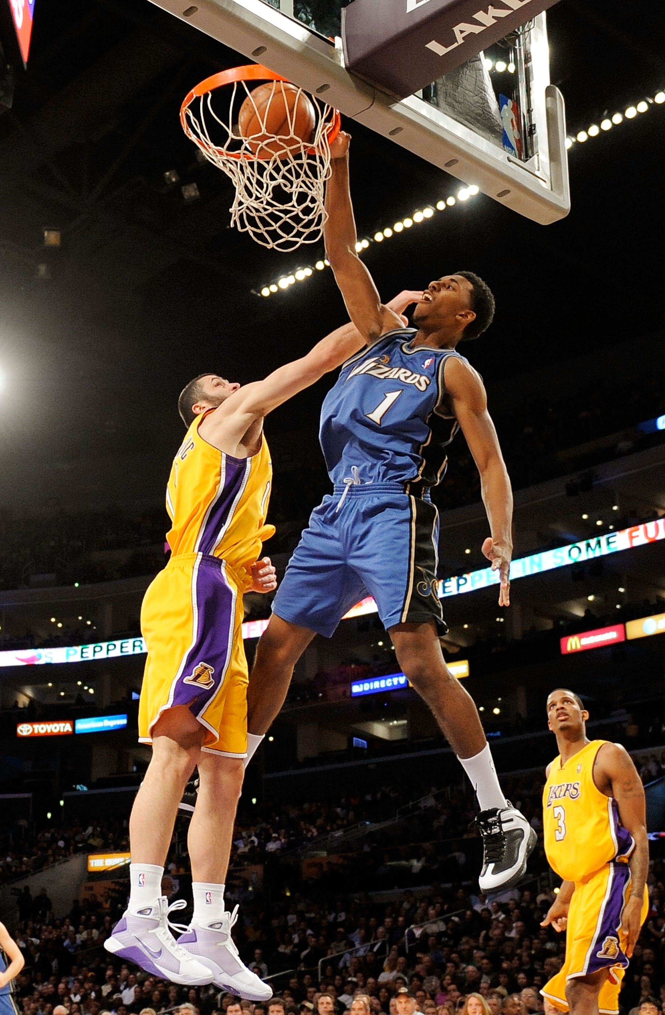 LOS ANGELES, CA - JANUARY 22:  Nick Young #1 of the Washington Wizards dunks against Vladimir Radmanovic #10 of the Los Angeles Lakers during the fourth quarter at the Staples Center January 22, 2009 in Los Angeles, California. NOTE TO USER: User expressl
