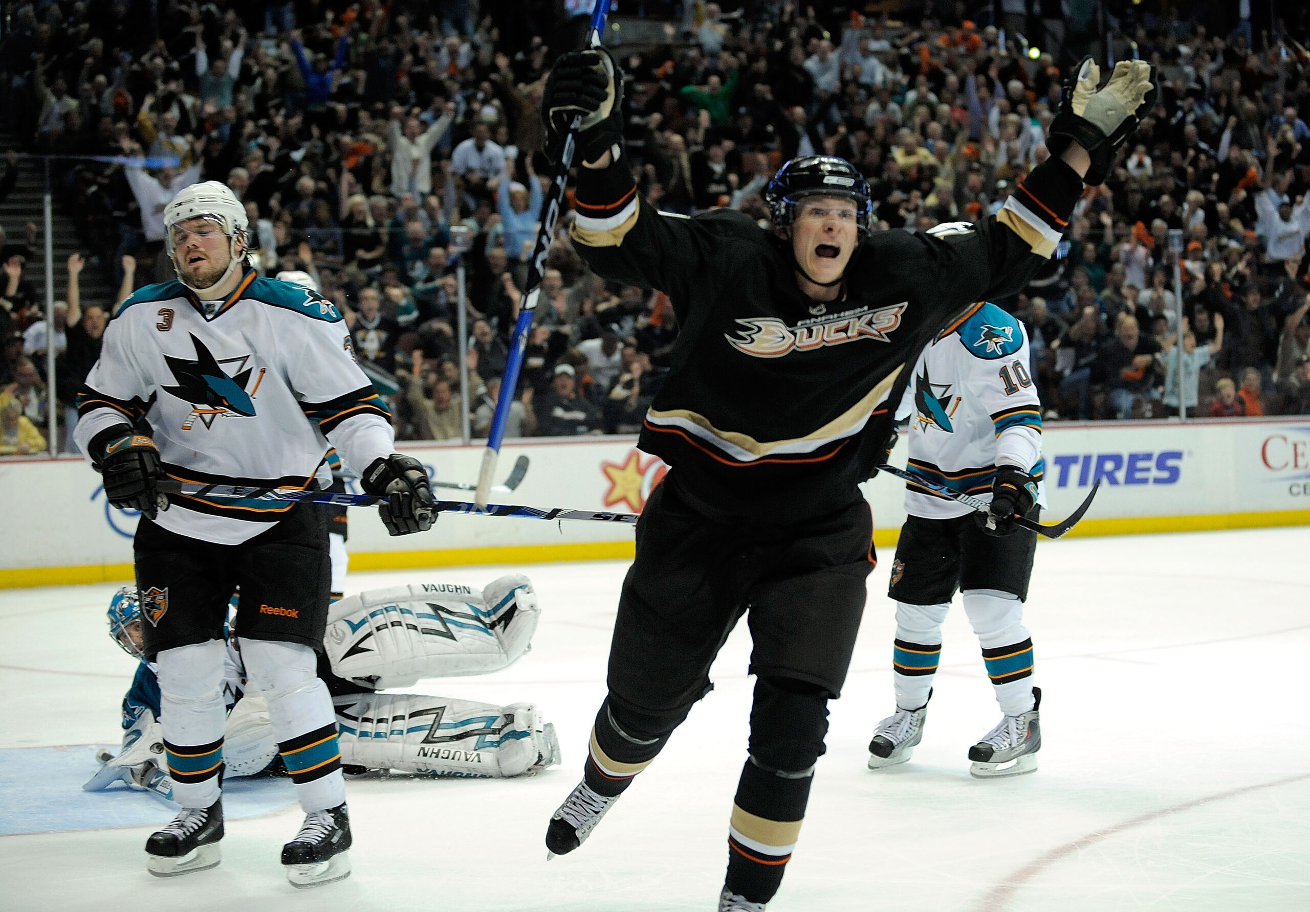 ANAHEIM, CA - APRIL 23:   Douglas Murray #3 of the San Jose Sharks reacts with closed eyes as Corey Perry #10 of the Anaheim Ducks celebrates his third period goal during Game Four of the Western Conference Quarterfinal Round of the 2009 Stanley Cup Playo