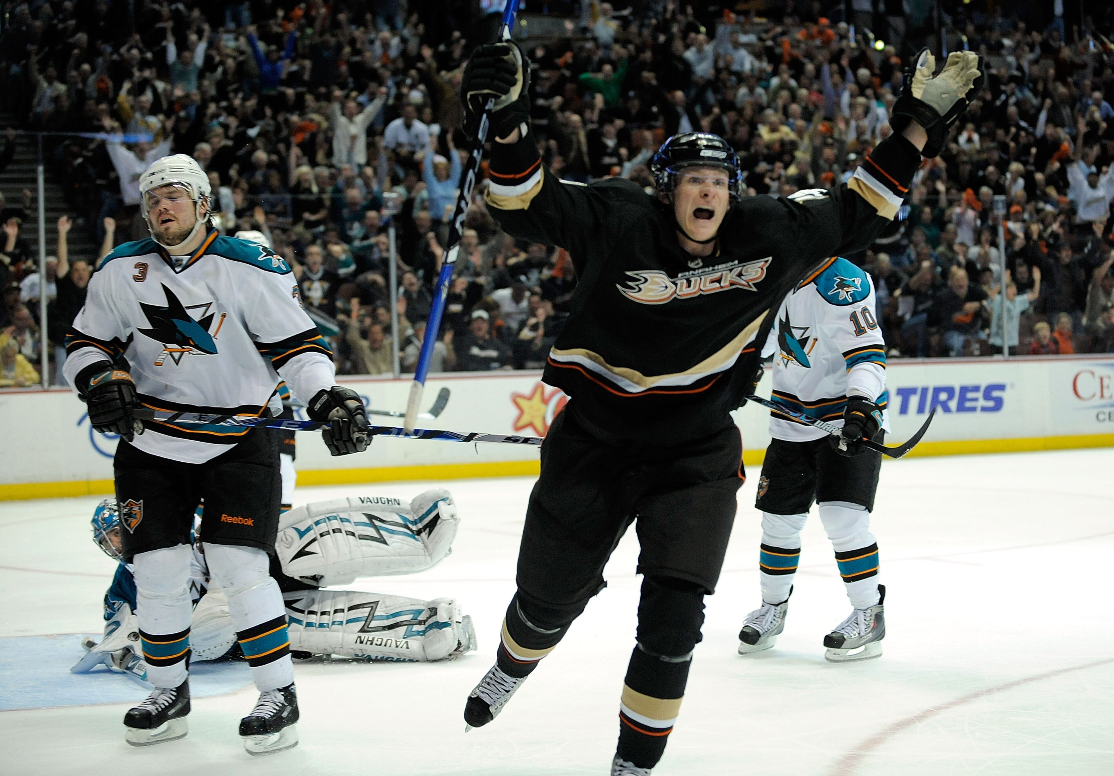 ANAHEIM, CA - APRIL 23:   Douglas Murray #3 of the San Jose Sharks reacts with closed eyes as Corey Perry #10 of the Anaheim Ducks celebrates his third period goal during Game Four of the Western Conference Quarterfinal Round of the 2009 Stanley Cup Playo