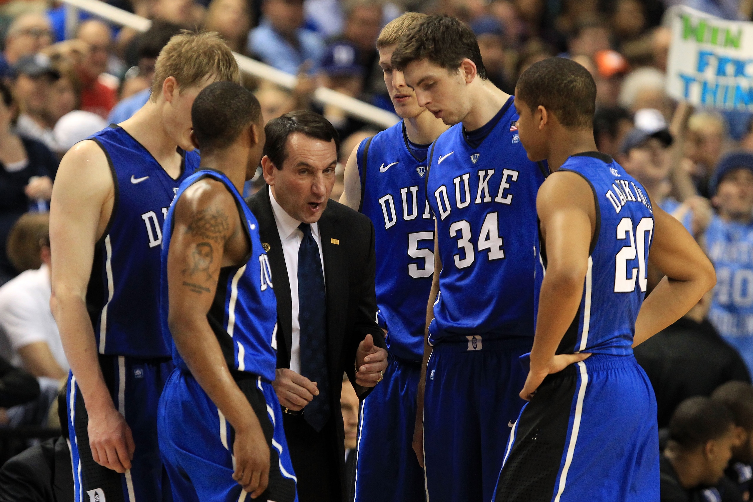 GREENSBORO, NC - MARCH 13:  Head coach Mike Krzyzewski of the Duke Blue Devils talks with players Kyle Singler #12, Nolan Smith #2, Mason Plumlee #5, Ryan Kelly #34 and Andre Dawkins #20 during the first half of the game against the North Carolina Tar Hee