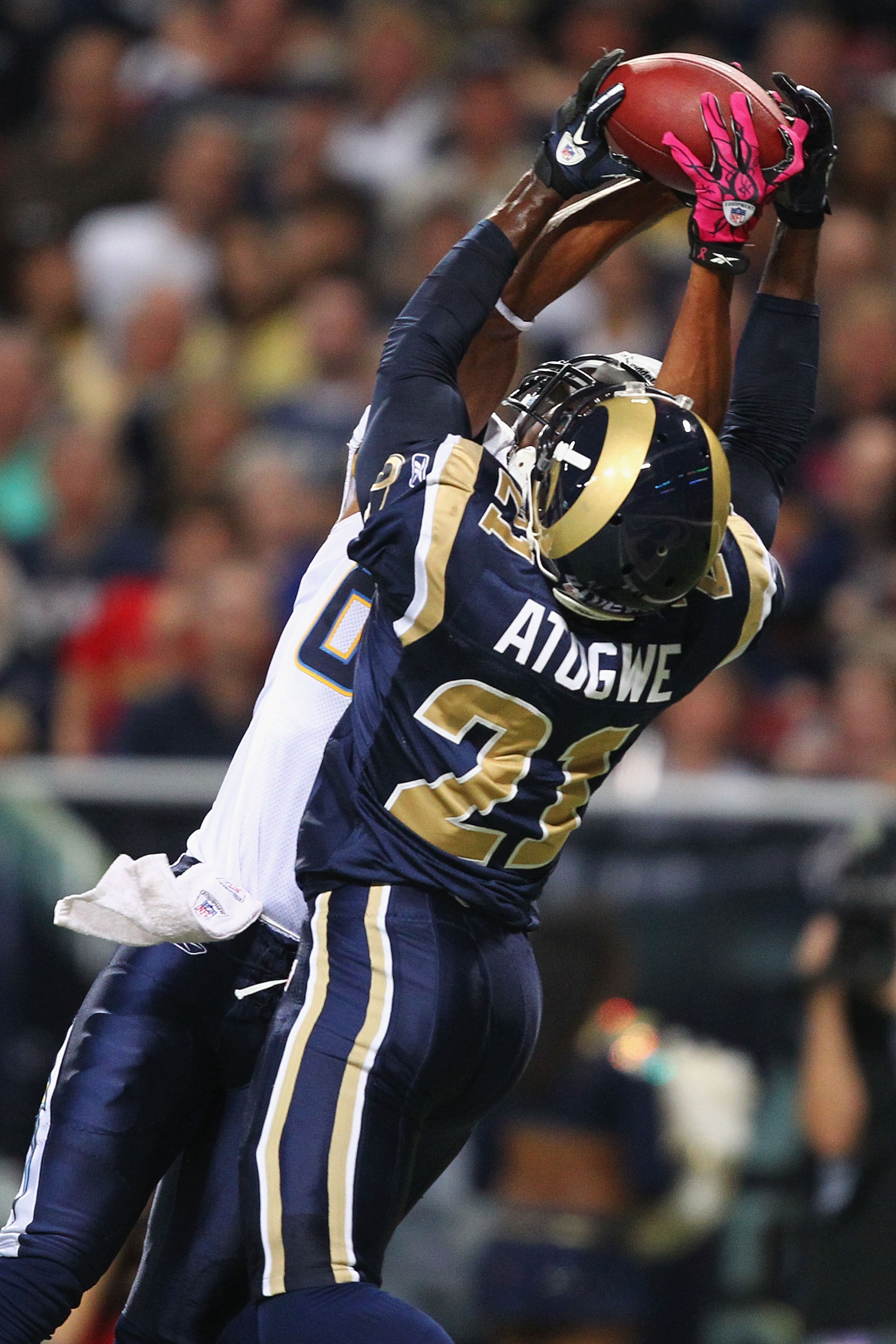 ST. LOUIS - OCTOBER 17: Oshiomogho Atogwe #21 of the St. Louis Rams intercepts a pass against the San Diego Chargers at the Edward Jones Dome on October 17, 2010 in St. Louis, Missouri.  The Rams beat the Chargers 20-17.  (Photo by Dilip Vishwanat/Getty I