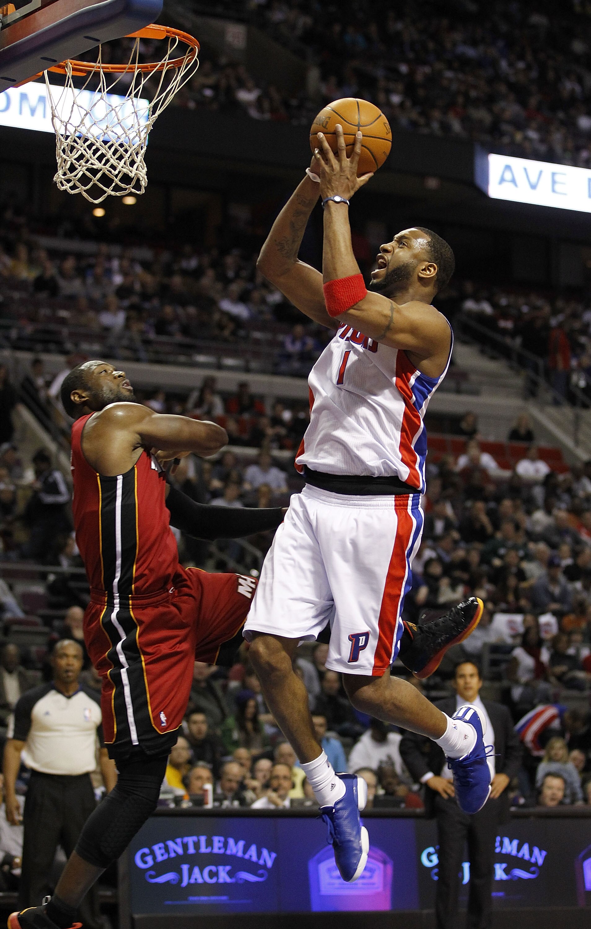 AUBURN HILLS, MI - MARCH 23:  Tracy McGrady #1 of the Detroit Pistons gets a shot off over Dwyane Wade #3 of the Miami Heat at The Palace of Auburn Hills on March 23, 2011 in Auburn Hills, Michigan. Miami won the game 100-94. NOTE TO USER: User expressly