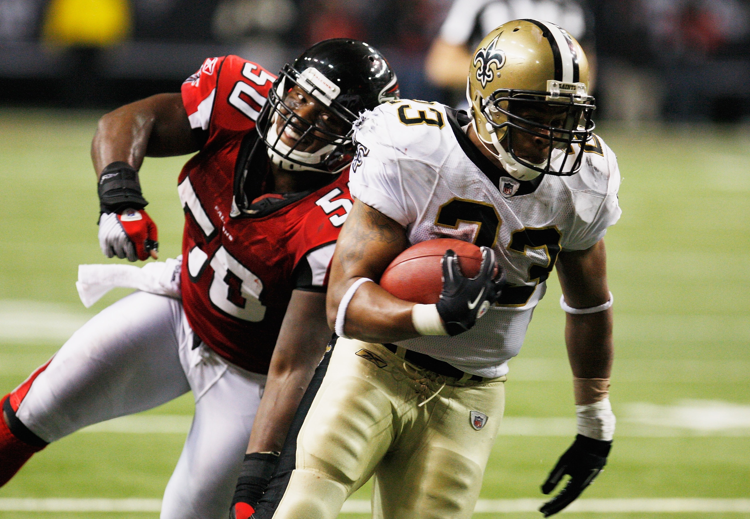 ATLANTA, GA - DECEMBER 27: Pierre Thomas #23 of the New Orleans Saints runs past Atlanta Falcons defender Curtis Lofton #50 in the second half during their game at the Georgia Dome on December 27, 2010 in Atlanta, Georgia. (Photo by Scott Halleran/Getty ATLANTA, GA - DECEMBER 27: Pierre Thomas #23 of the New Orleans Saints runs past Atlanta Falcons defender Curtis Lofton #50 in the second half during their game at the Georgia Dome on December 27, 2010 in Atlanta, Georgia. (Photo by Scott Halleran/Getty