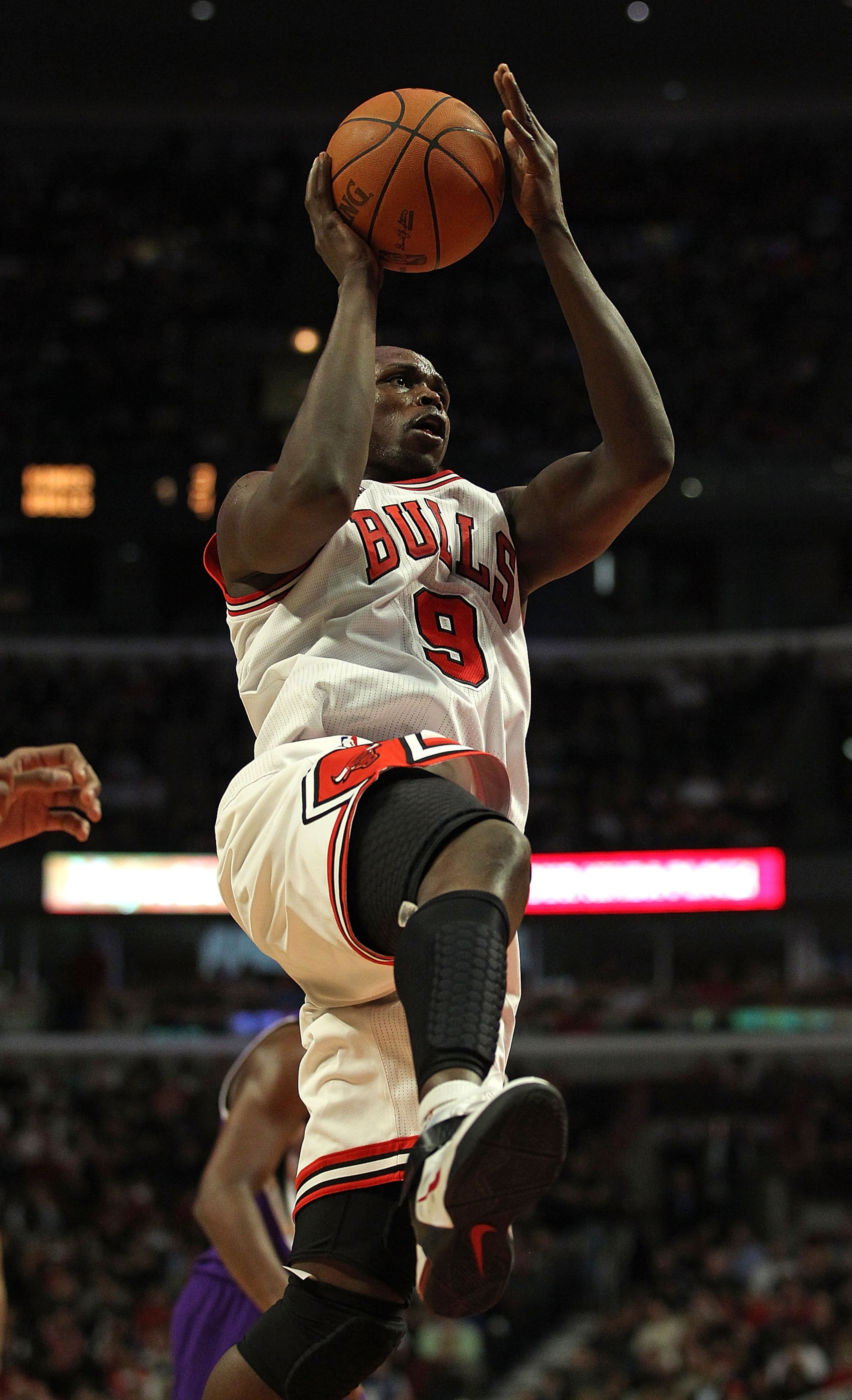 CHICAGO, IL - MARCH 21: Loul Deng #9 of the Chicago Bulls drives to the basket against the Sacramento Kings at the United Center on March 21, 2011 in Chicago, Illinois. The Bulls defeated the Kings 132-92. NOTE TO USER: User expressly acknowledges and agr