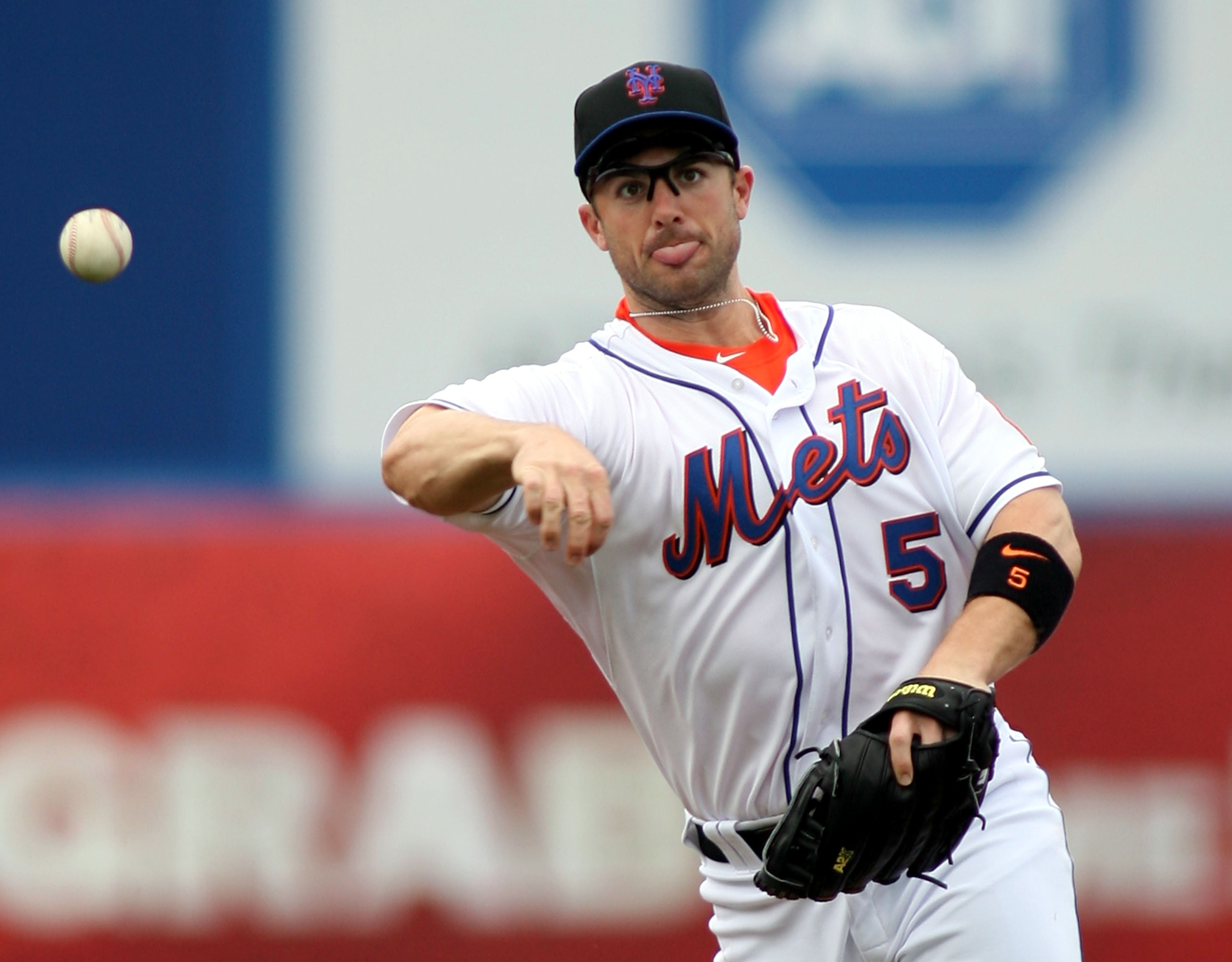 PORT ST. LUCIE, FL - FEBRUARY 26:  Third baseman David Wright #5 throws against the Atlanta Braves at Digital Domain Park on February 26, 2011 in Port St. Lucie, Florida.  (Photo by Marc Serota/Getty Images)