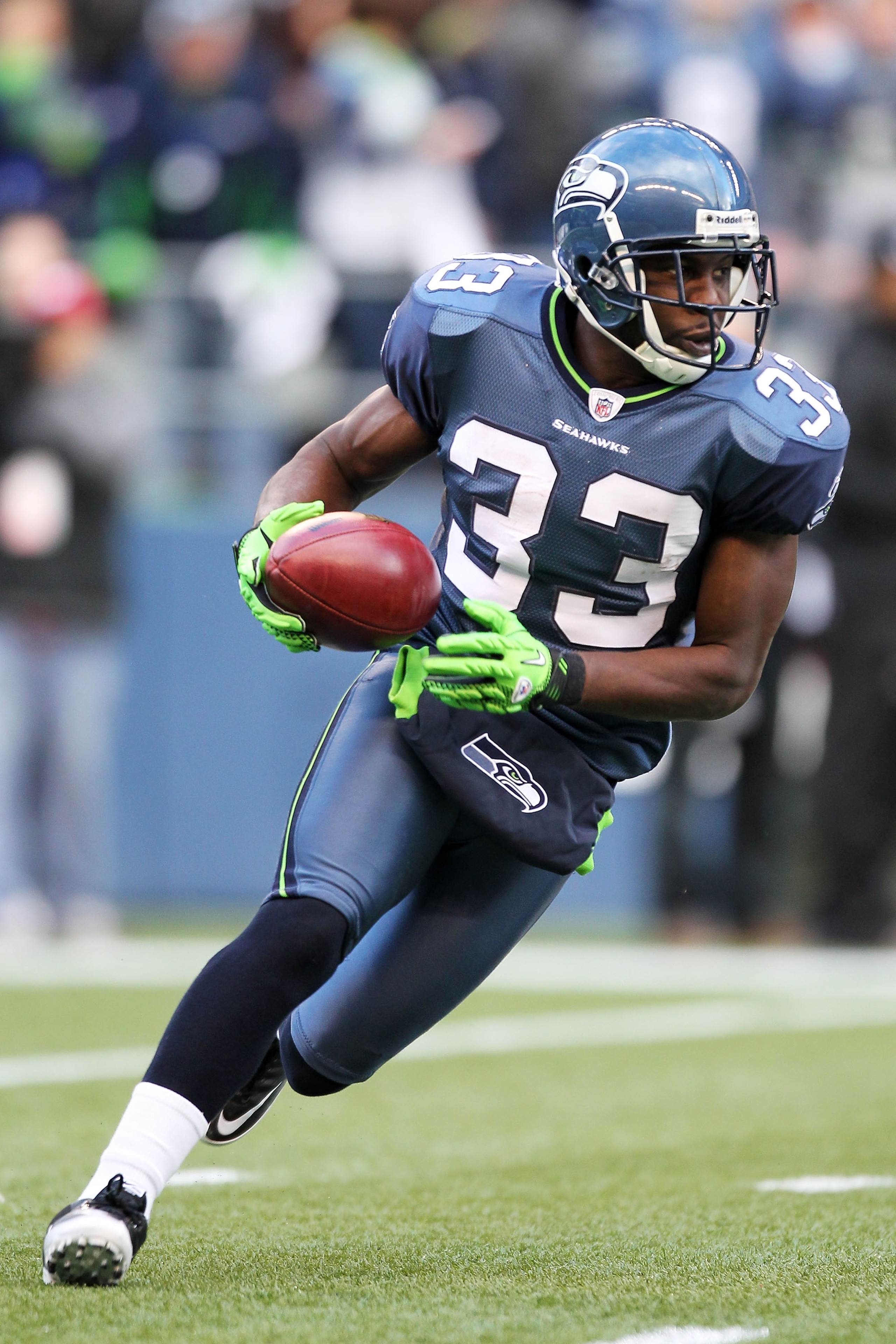 SEATTLE, WA - JANUARY 08:  Leon Washington #33 of the Seattle Seahawks runs down field against the New Orleans Saints during the 2011 NFC wild-card playoff game at Qwest Field on January 8, 2011 in Seattle, Washington.  (Photo by Otto Greule Jr/Getty Imag