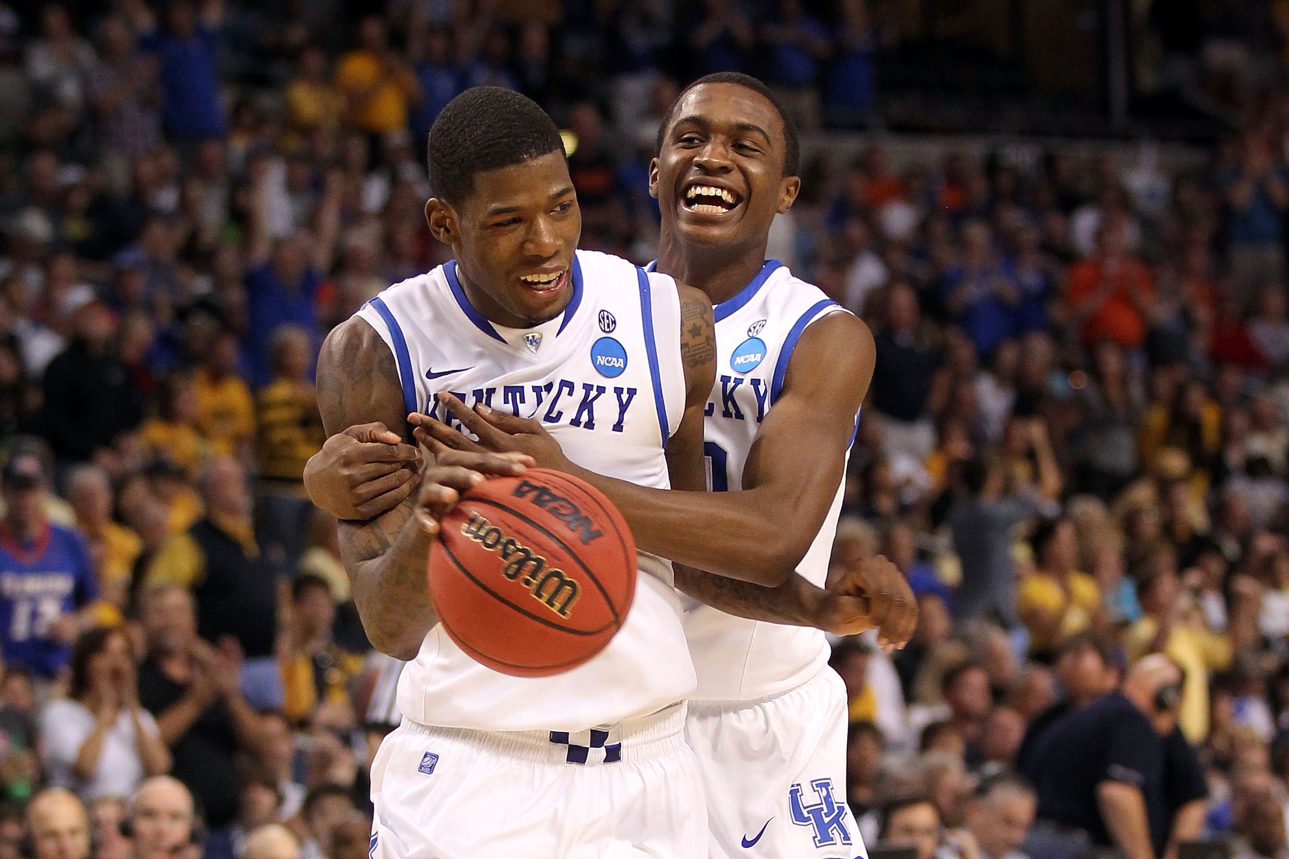 TAMPA, FL - MARCH 19:  (L-R) DeAndre Liggins and Doron Lamb #20 of the Kentucky Wildcats celebrate after they won 71-63 against the West Virginia Mountaineers during the third round of the 2011 NCAA men's basketball tournament at St. Pete Times Forum on M